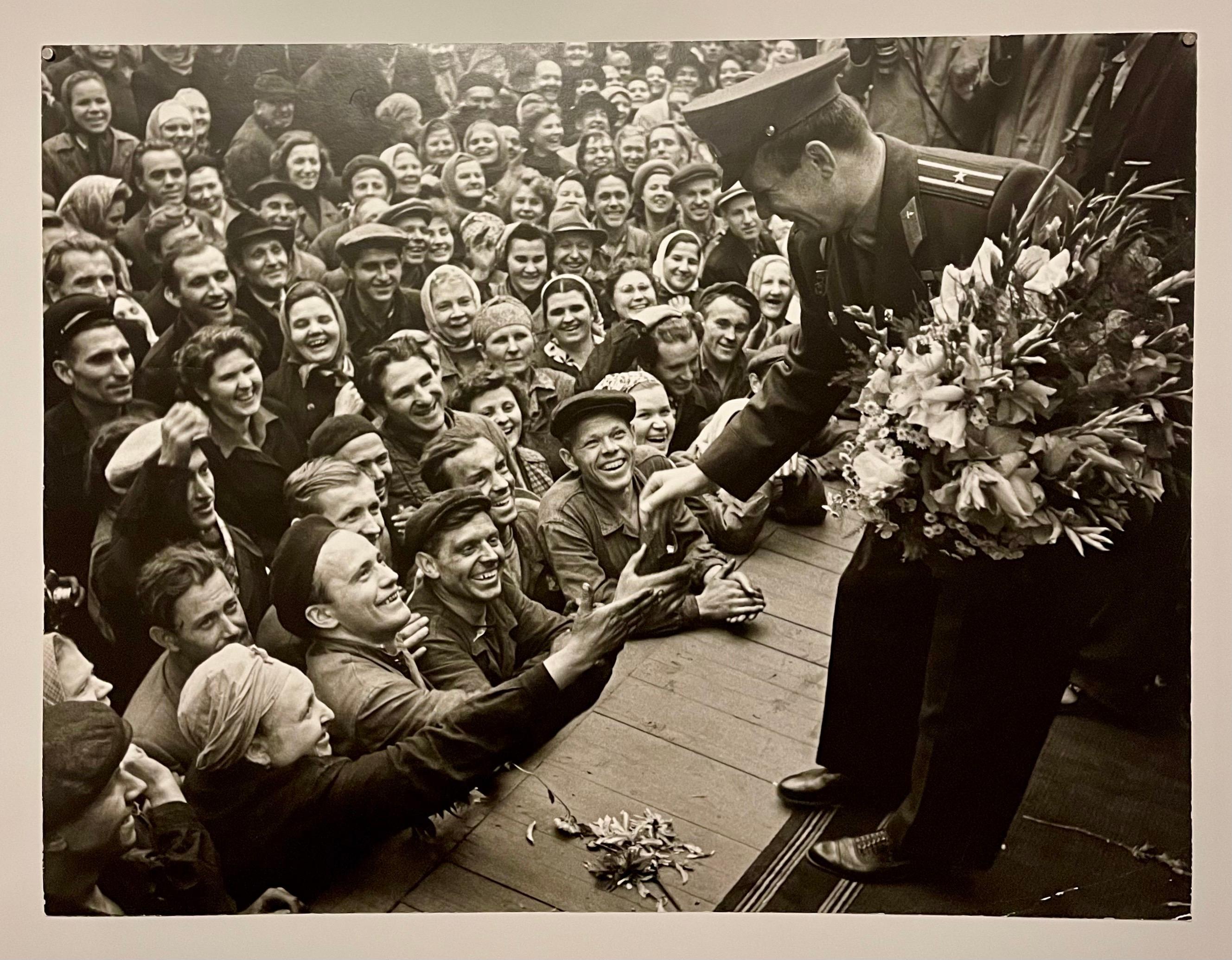 Yuri Gagarin Meeting Workers at Foundry Stankolit, depicting the famous Russian cosmonaut (Moscow, 1961)
Gelatin silver print, matte finish, date of printing unknown.
Provenance: acquired from the estate of photographer Samariy Gurariy. 

Samariy