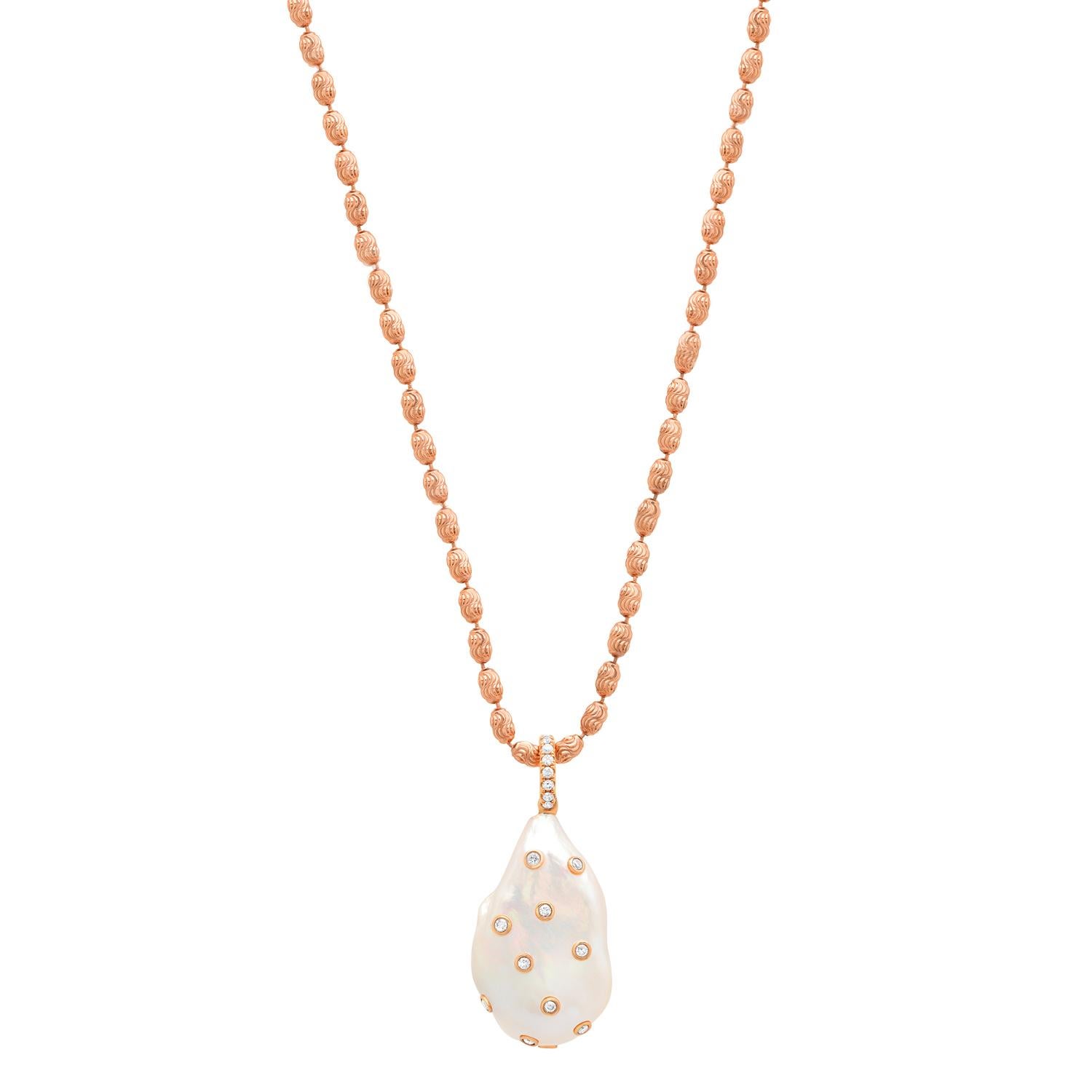 Stunning pendant necklace by Los Angeles based fine jewelry designer, Samira 13. XL Baroque Freshwater pearl pendant with bezel set diamonds in 18K rose gold with Rose Gold Plated Chain. 

Exploring the unique and varied aspects of pearls is the