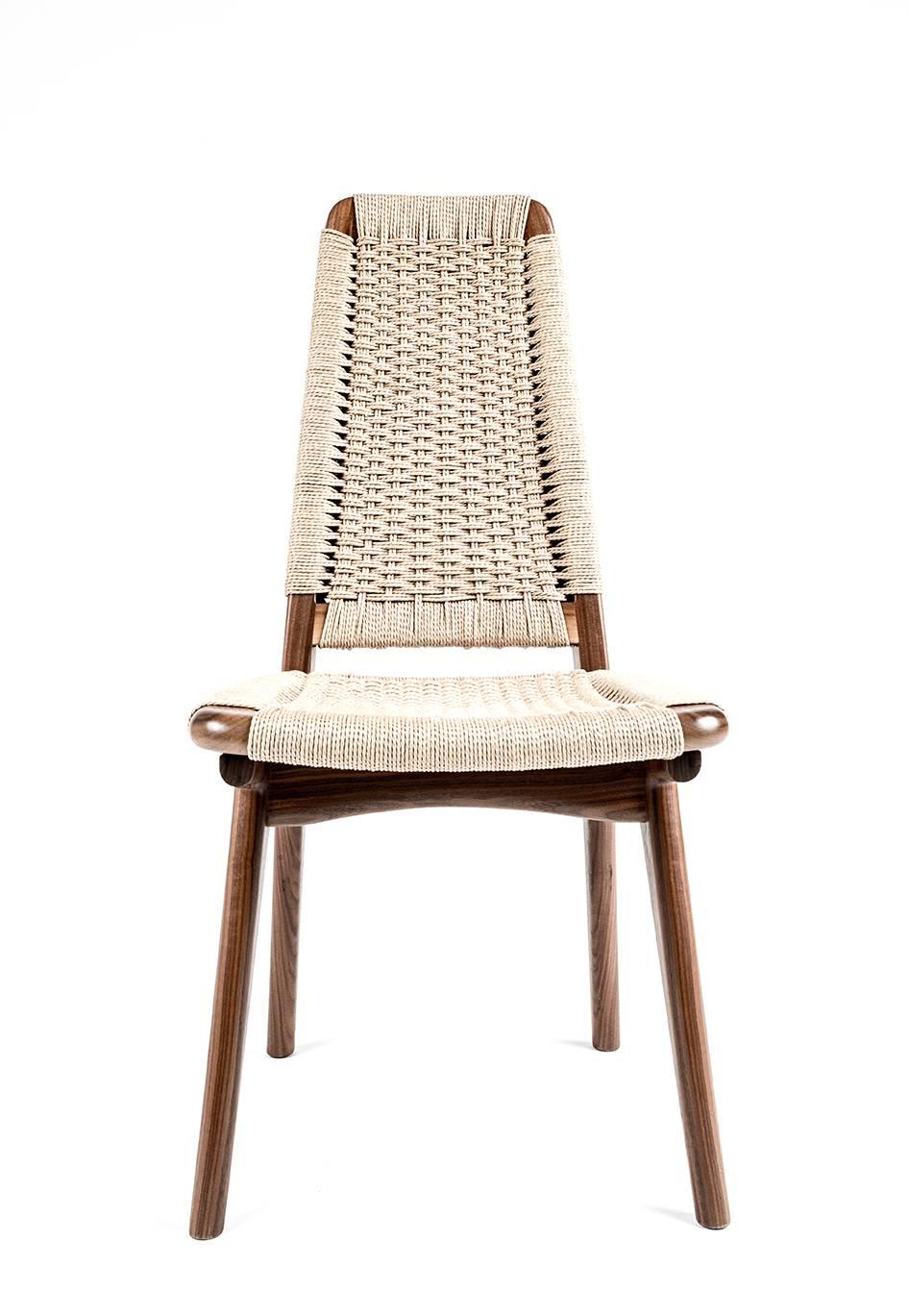 *This listing is for a lightly used Rian high back chair in walnut with natural Danish cord. There are four sample sale chairs available and all are in excellent, like new condition.

Mid-century inspired, hardwood and woven Danish cord dining or