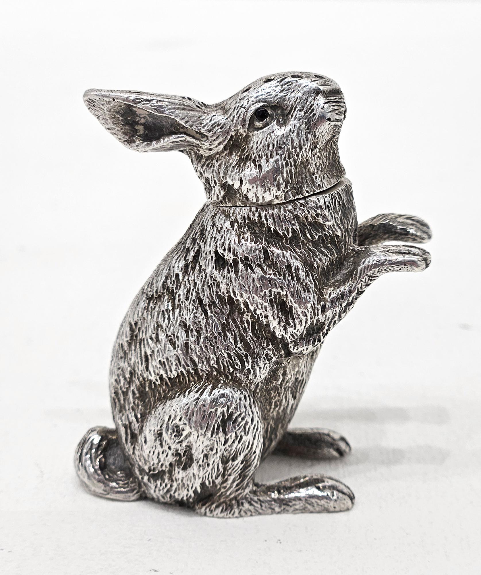 A late Victorian sterling silver pepperette in the form of a rabbit or hare, made by Sampson Mordan & Co of London in 1899. 

It is very finely modelled as a rabbit sitting up on its haunches with a removable head to be filled with pepper. This
