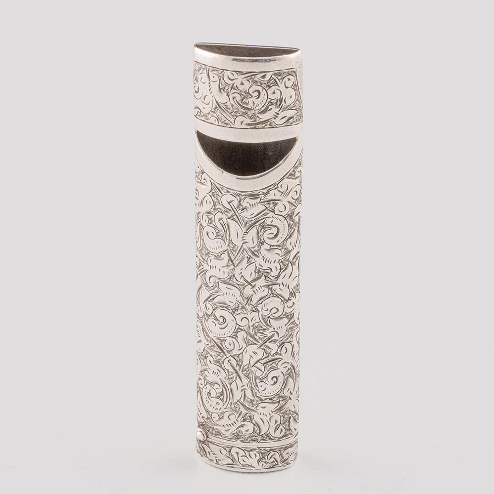 Heading : Sampson Mordan vesta case with whistle
Date : Hallmarked in London in 1884 for Mordan
Period : Victoria
Origin : London, Engalnd
Decoration : Heavily chased scrolled design. To one end is the whistle, to the other is a hinged cover for the