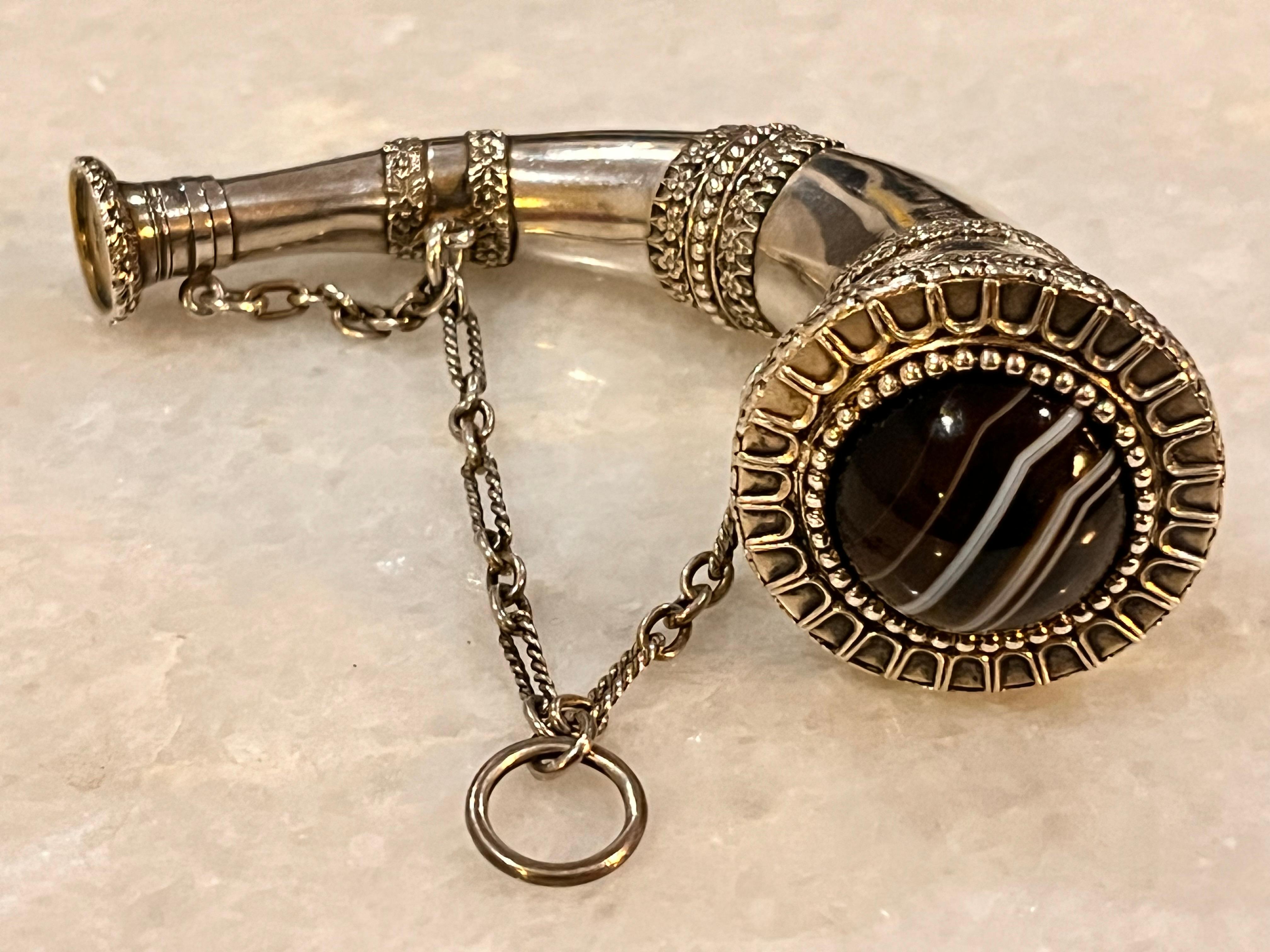 An extremely rare and fabulous quality, large-size Victorian novelty silver horn-shaped combination scent bottle and vinaigrette, the body applied with cast floral and foliate scroll bands, the hinged cover inset with a polished specimen banded