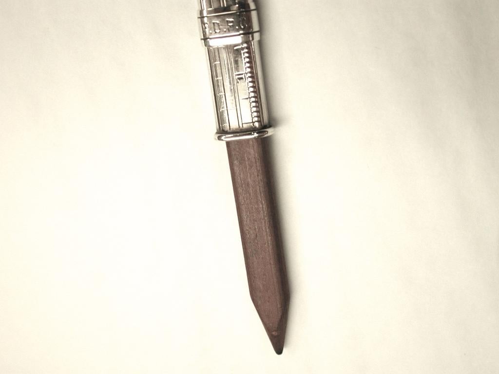 Samson Mordan Victorian Sterling silver draftsman pencil holder and ruler, circa 1890
Wonderful novelty pencil holder, which can be used as a ruler for measurements upto 7 inches and 18 centimeters.
All engraved by hand with original owner's