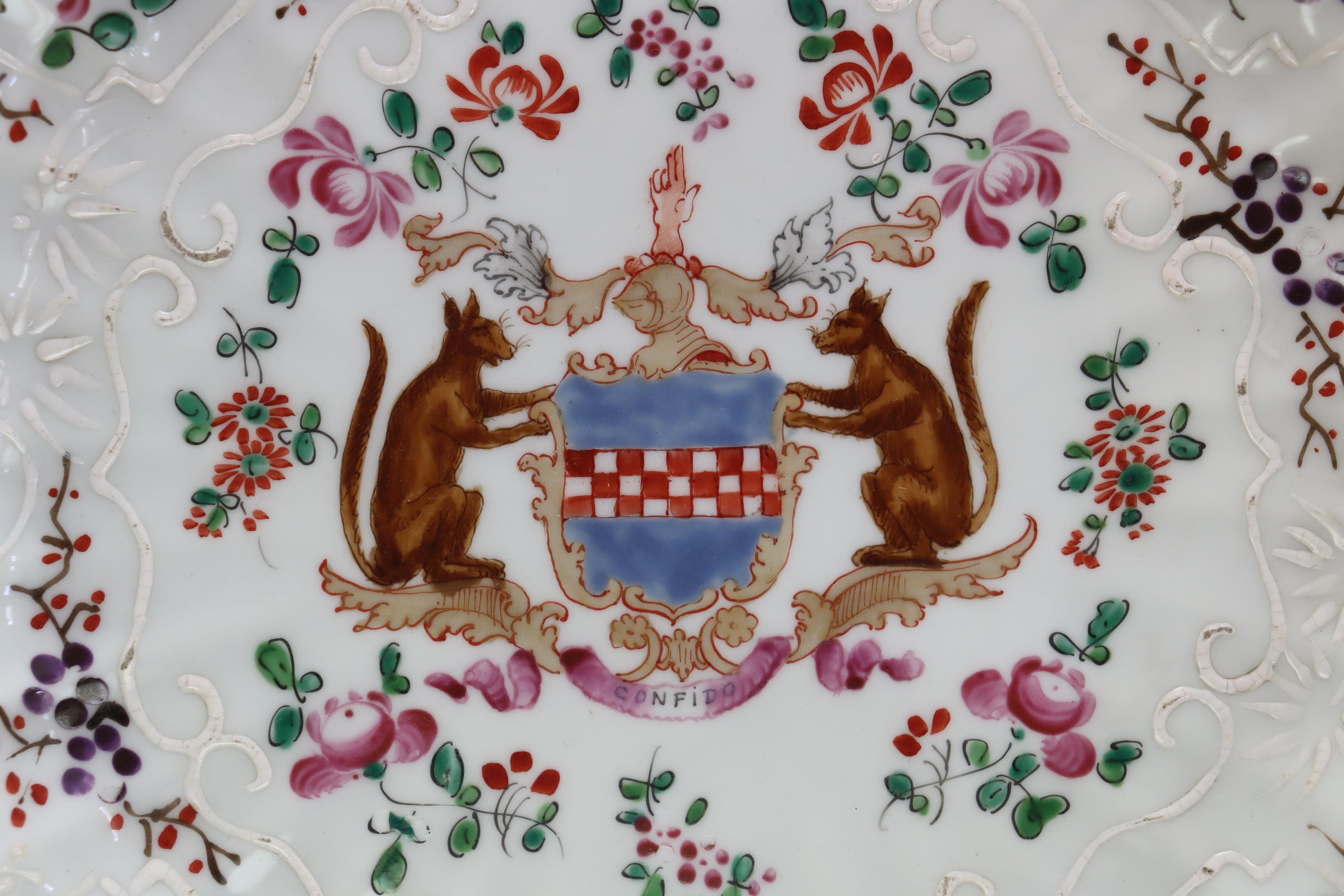 This mock Chinese export ware armorial plate was made by Samson of Paris in the period 1890-1910. It is decorated to the centre with, what purports to be, the armorial, or family crest, of the Boyd family, using the Boyd families' motto 