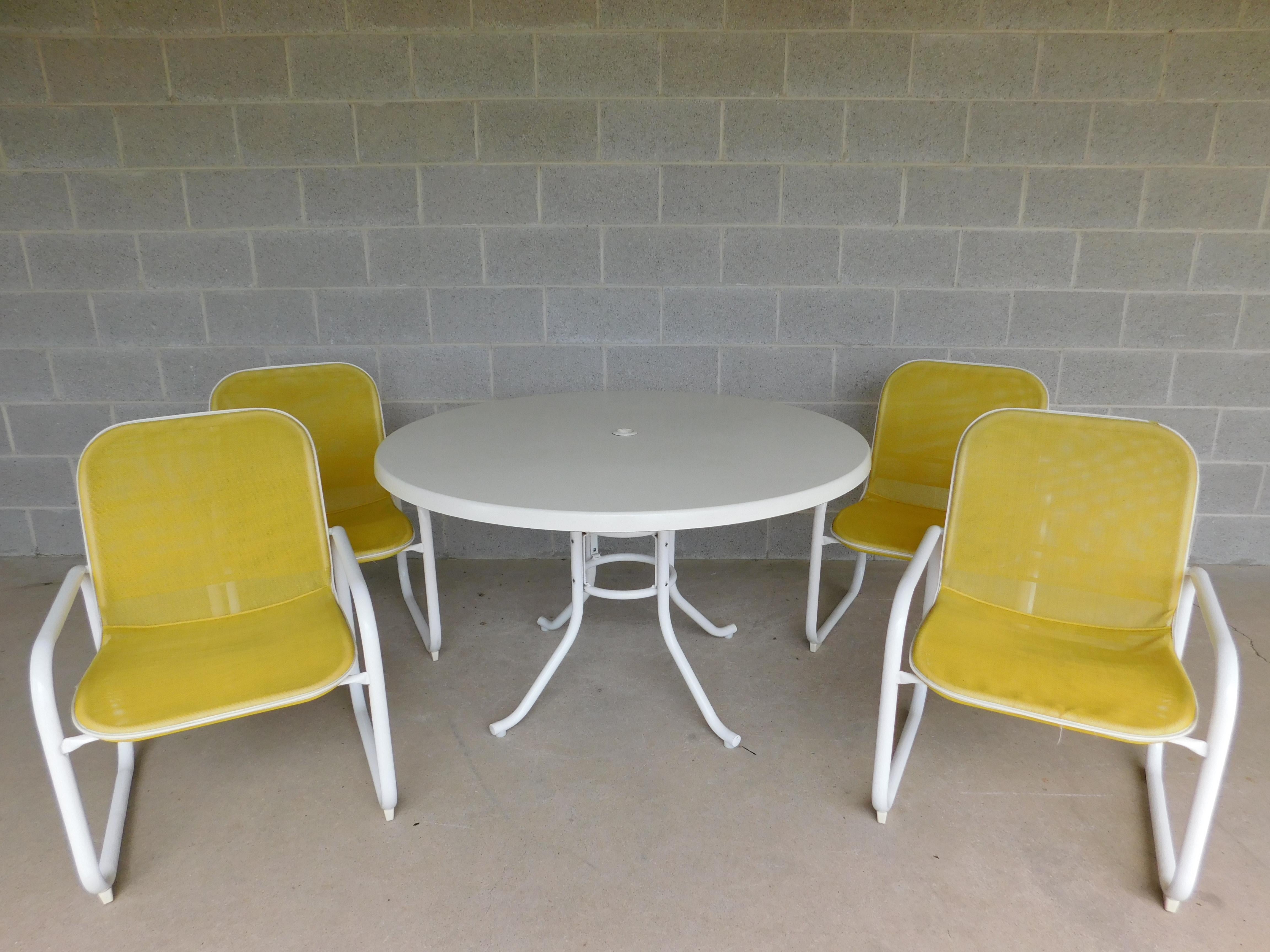 Features Quality Crafted, White Aluminum Frame / Base, Fiberglass Top Table, All Weather Mesh Synthetic Material for Chairs in Lemon Drop Yellow Color. 
Very Good Condition, original finish, 

Table 48