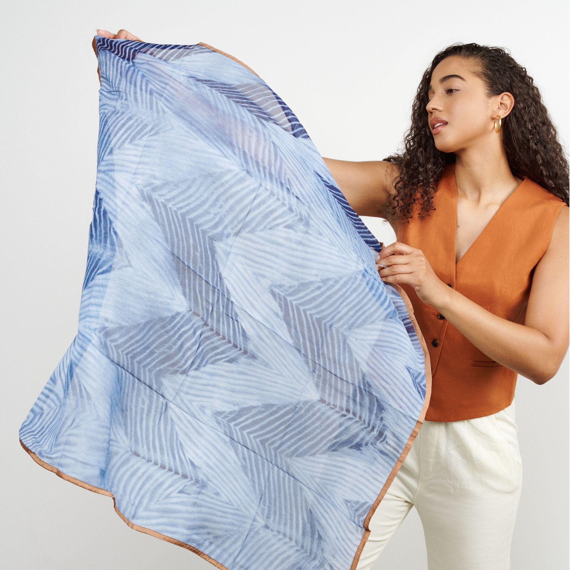 ​Add a tinge of serenity with our beautiful Samu Indigo Scarf which is apure statement piece that adds modern and timeless quality as an accessory which can be used suitably for personal / workwear, as a travel accessory or a thoughtful gift. Hem of