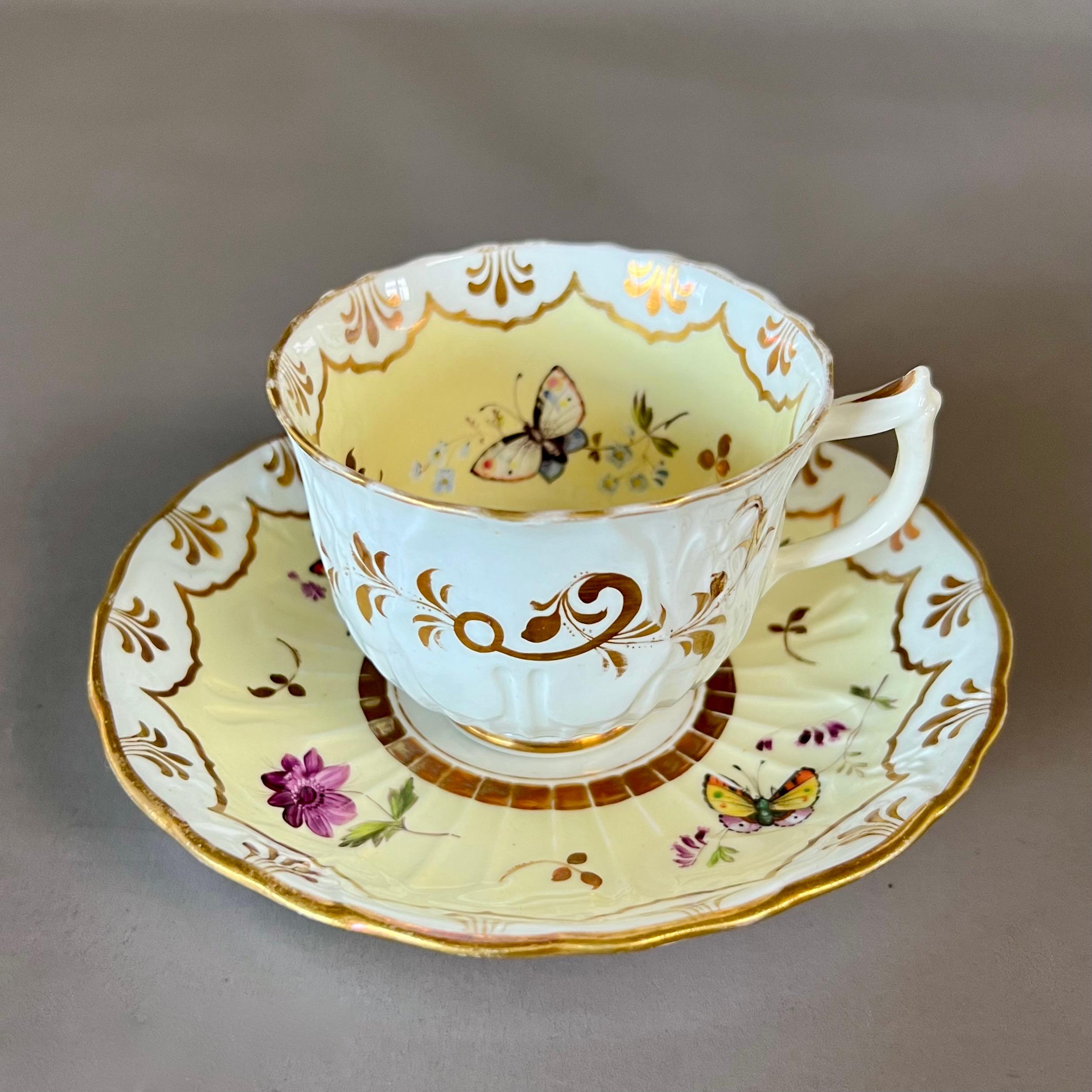 A coffee cup and saucer in “embossed fluted” shape, pale yellow ground with flowers and butterflies

Pattern 4626
Year: ca 1834
Size: teacup 8cm (3.15“),saucer 14.5cm (5.75“) diameter
Condition: excellent, some stacking wear

The Samuel Alcock