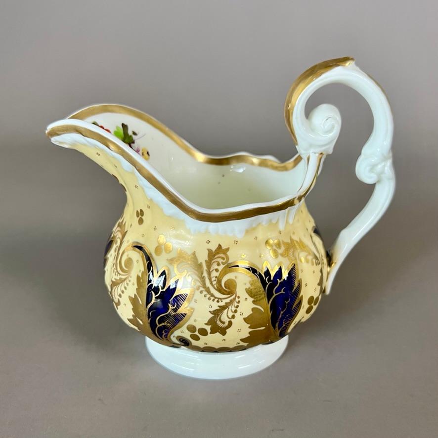 Un pot à lait ou un crémier en forme de 