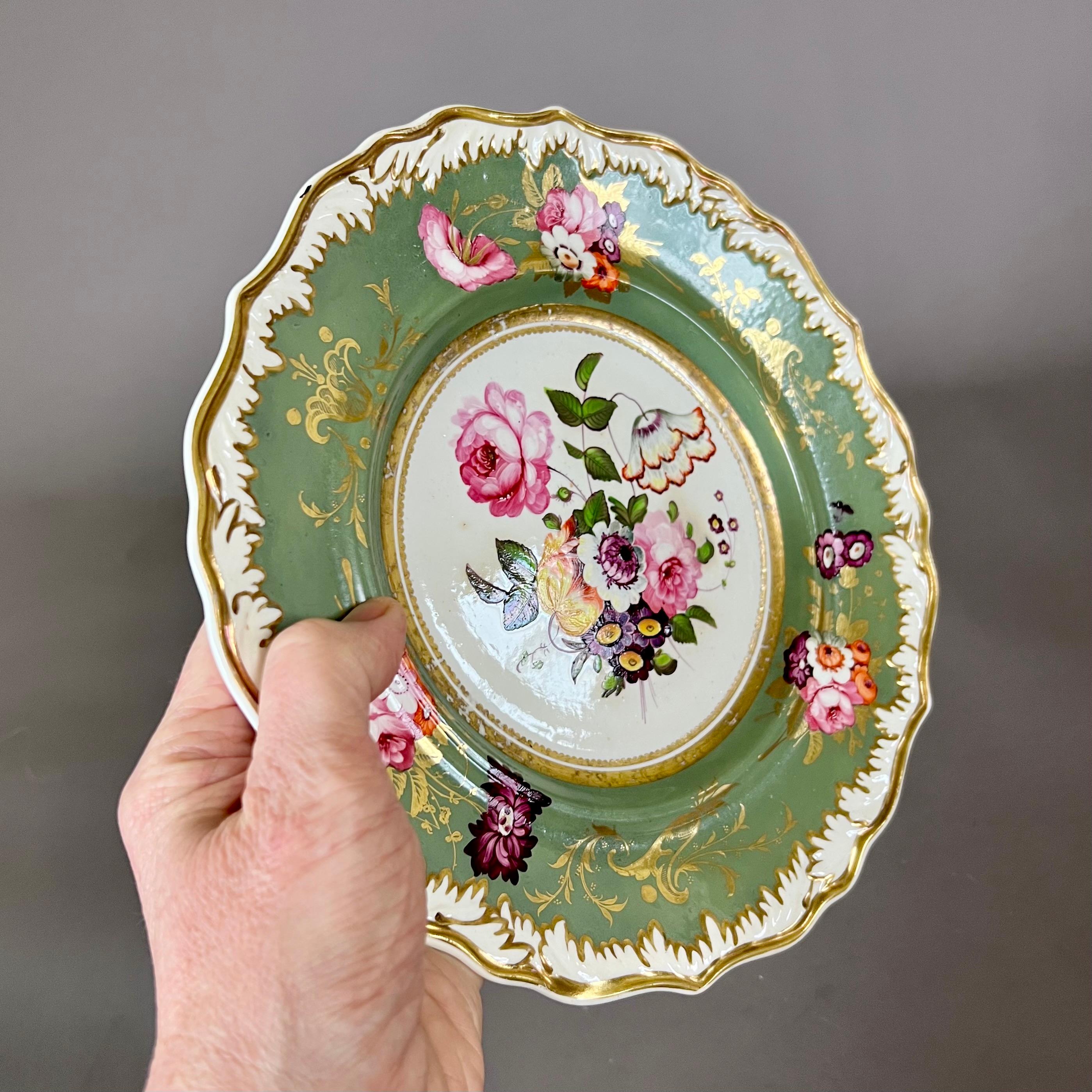 A plate with white melted snow border on a sepia green ground with gilt and full colour flower sprays, and a beautifully painted flower bouquet in the centre

Provenance: Geoffrey A. Godden collection

Pattern 843
Year: ca 1822
Size: 23cm  diameter