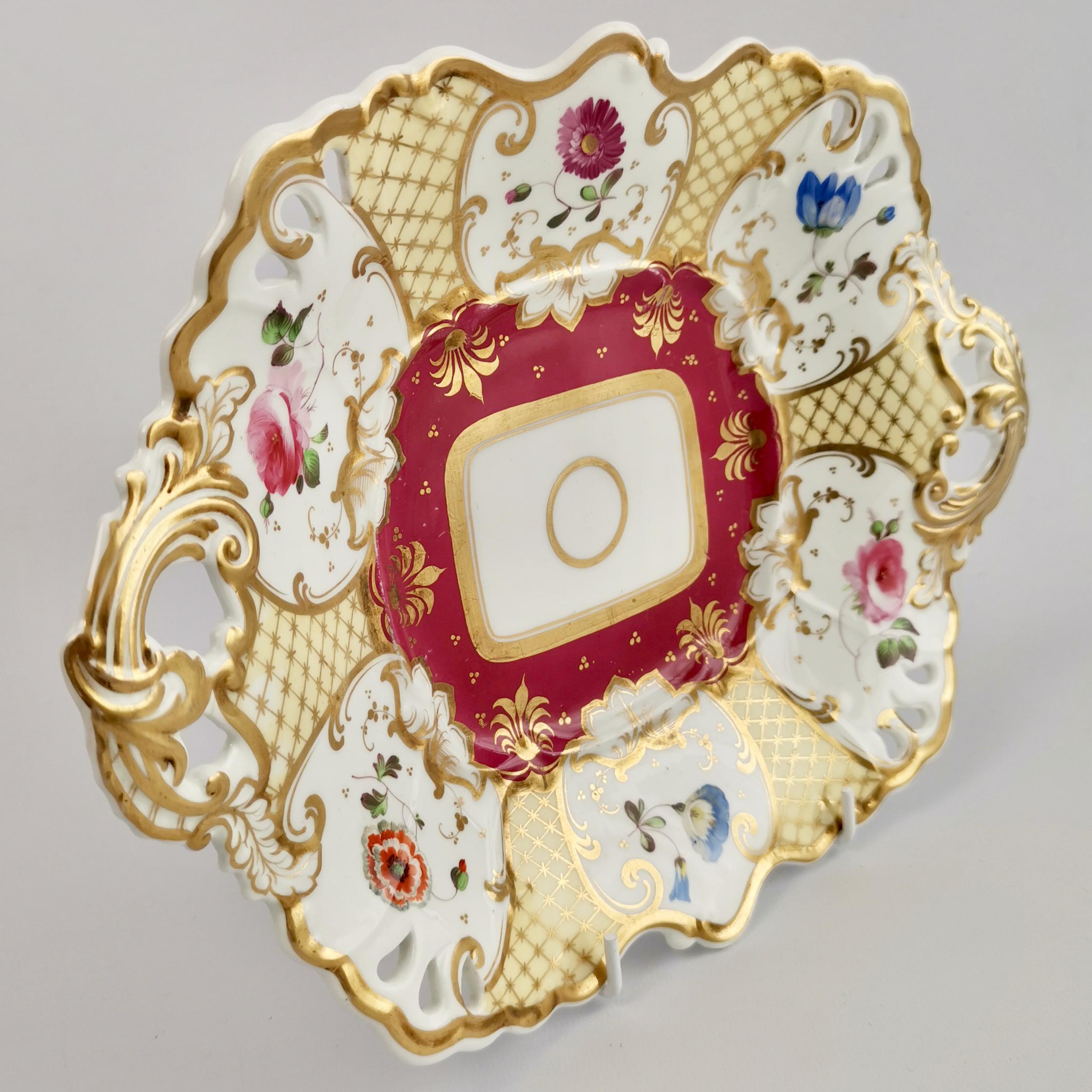 This is a very striking two-handled serving dish made by Samuel Alcock around the year 1835. The dish has a beautiful maroon and cream ground with rich gilding and beautiful hand painted flowers.

Samuel Alcock was one of the many potters in