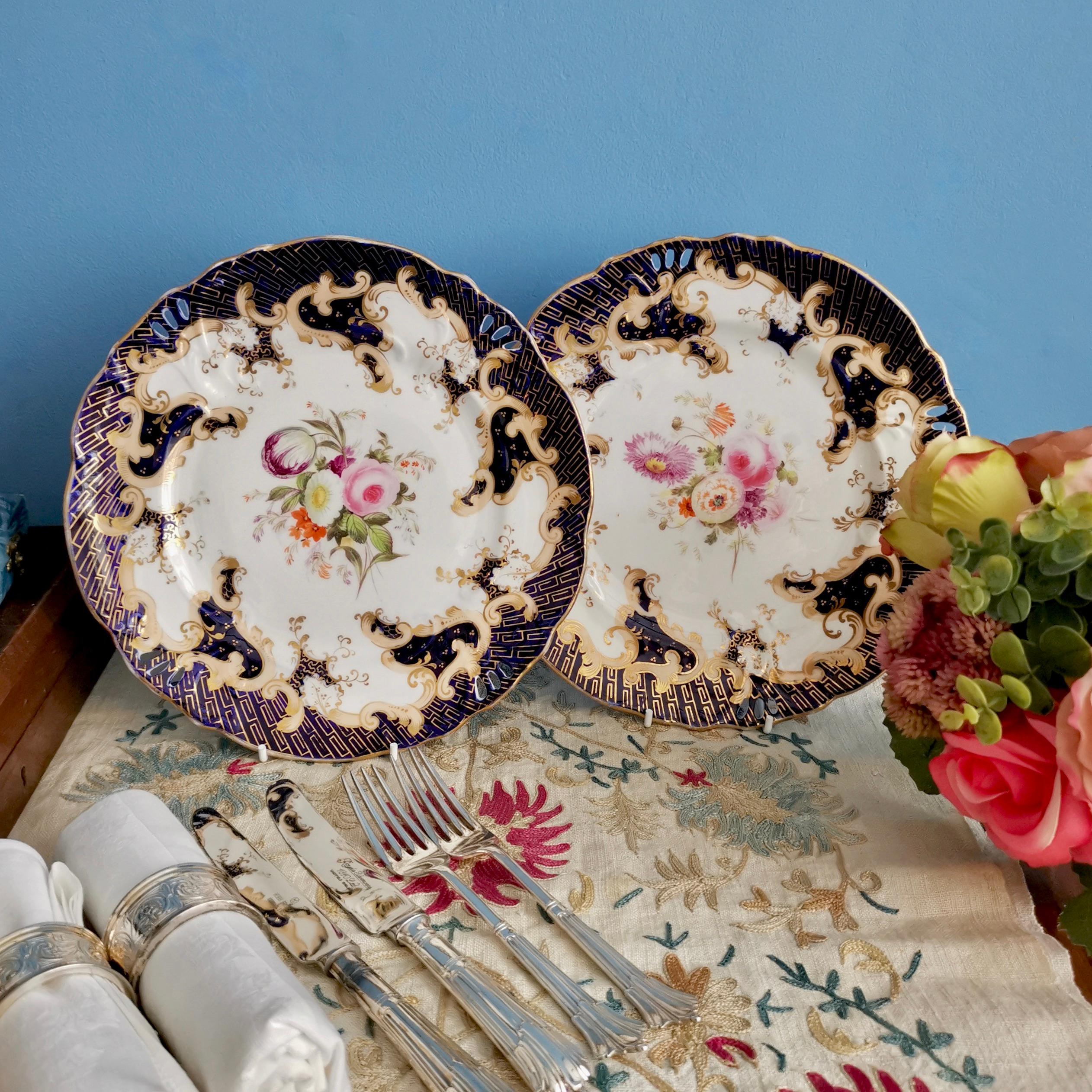 This is a beautiful dessert plate made by Samuel Alcock circa 1845 during Rococo Revival era. The plate is decorated in cobalt blue, gilt and beautiful flowers, and has a 