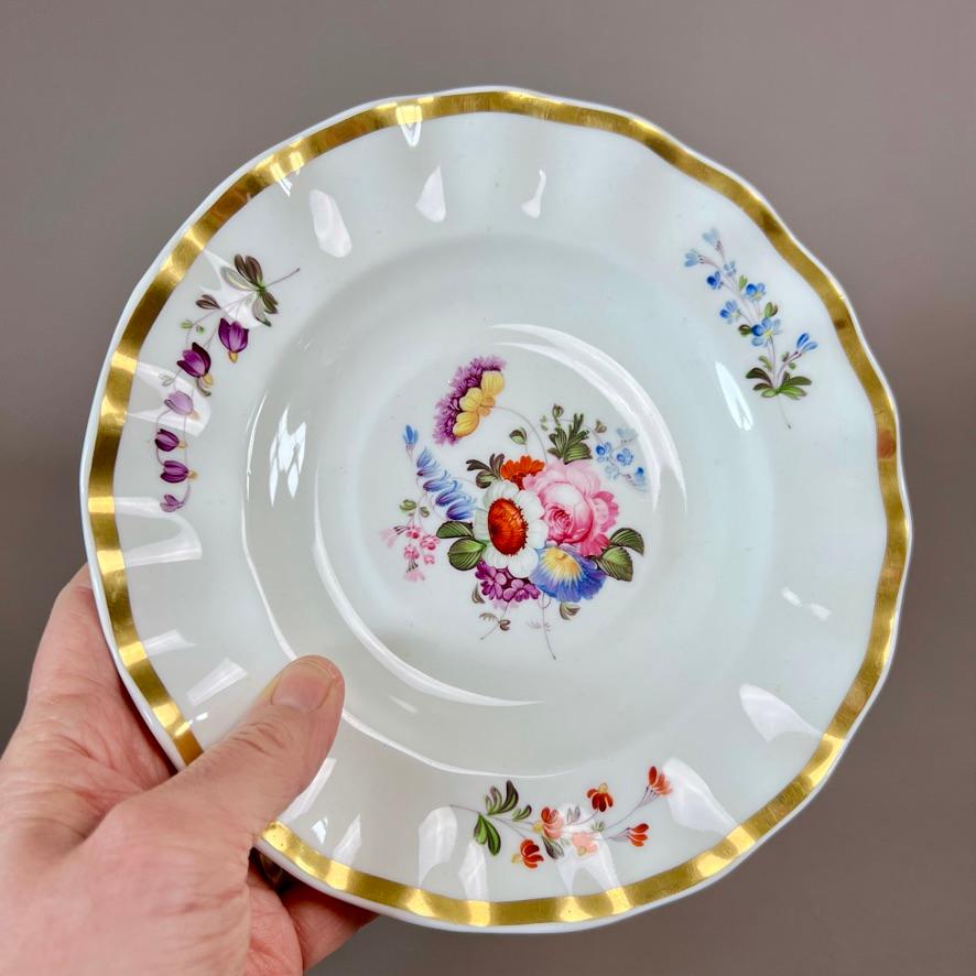 A plate or tureen stand in “wave edge” shape, simple gilt border and beautiful hand painted flower sprays

Pattern 1082
Year: ca 1823
Size: 21cm (9”)
Condition:  excellent

There are several items of this design available, please see separate l