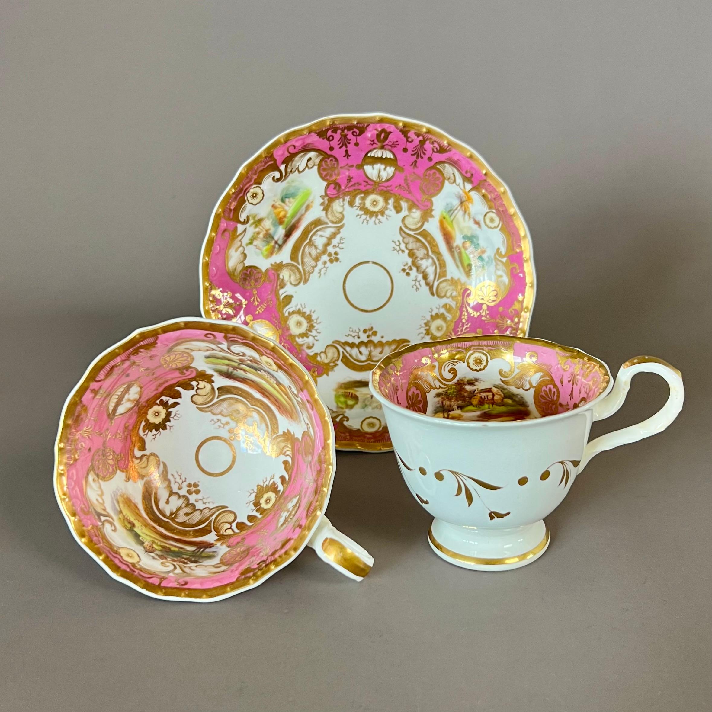 A “true trio” consisting of a teacup, coffee cup and saucer in “bell embossed” shape, pink ground with elaborate gilt and very finely painted landscape reserves

Pattern 2464
Year: ca 1827
Size: teacup 10cm (4“), coffee cup 8.2cm (3.25“), saucer