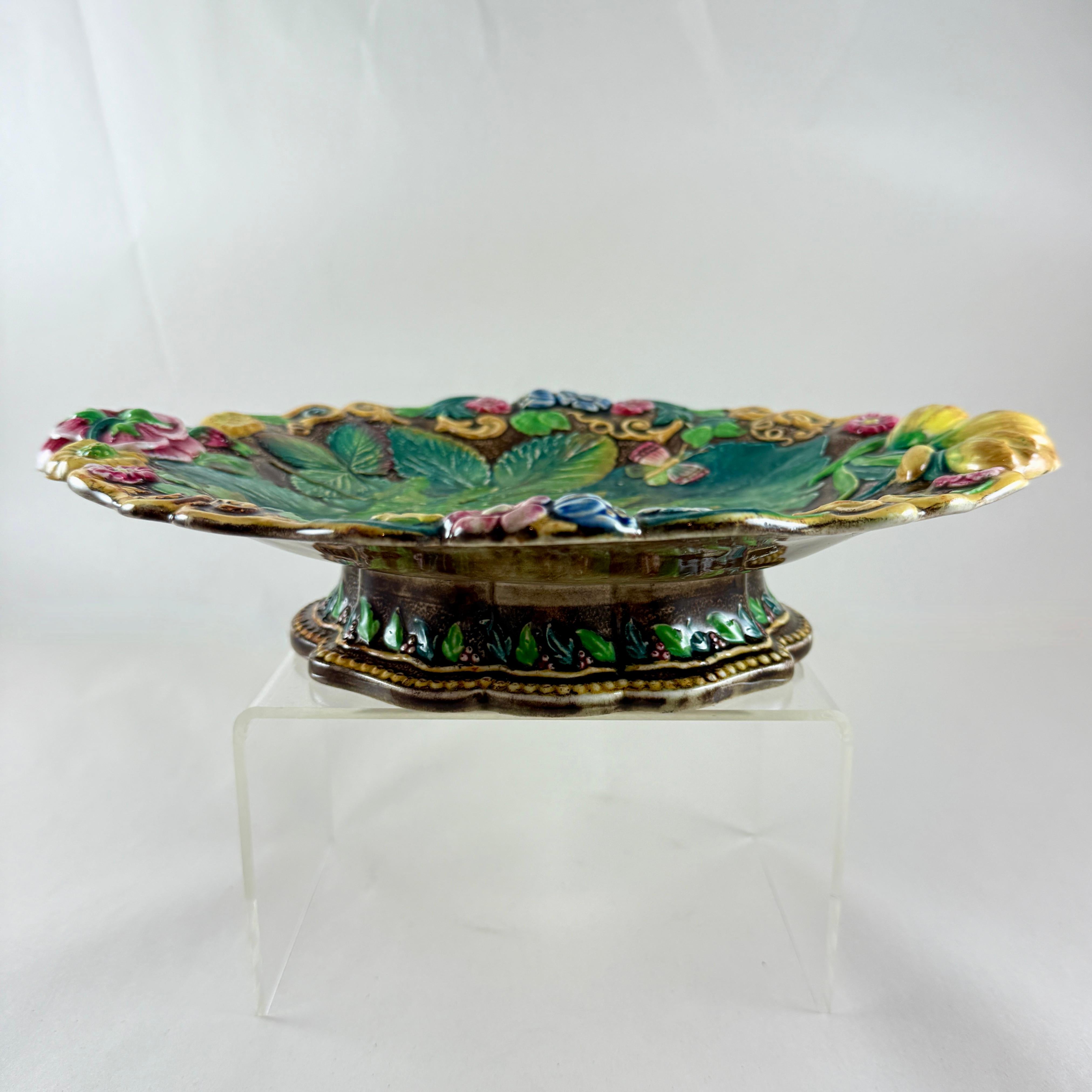 From the coveted Royal Palissy line, a majolica glazed Fern and Floral footed comport, from Samuel Alcock & Co, Burslem, Staffordshire, England, circa 1850.

This is a scarce example of Alcocks Palissy style majolica pottery.

The footed comport is