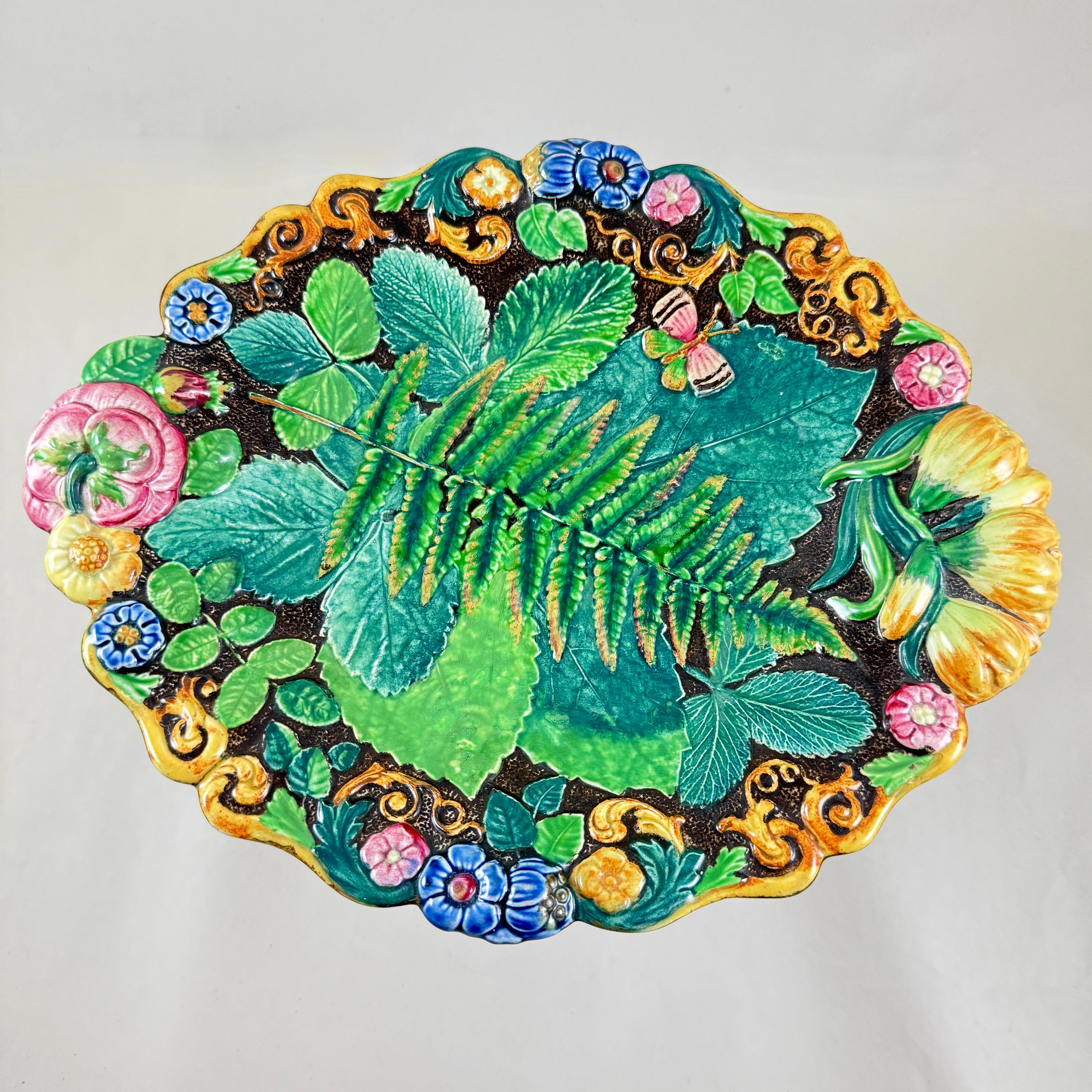 From the coveted Royal Palissy line, a majolica glazed Fern and Floral footed comport, from Samuel Alcock & Co, Burslem, Staffordshire, England, circa 1850.

This is a scarce example of Alcocks Palissy style majolica pottery.

The footed comport is