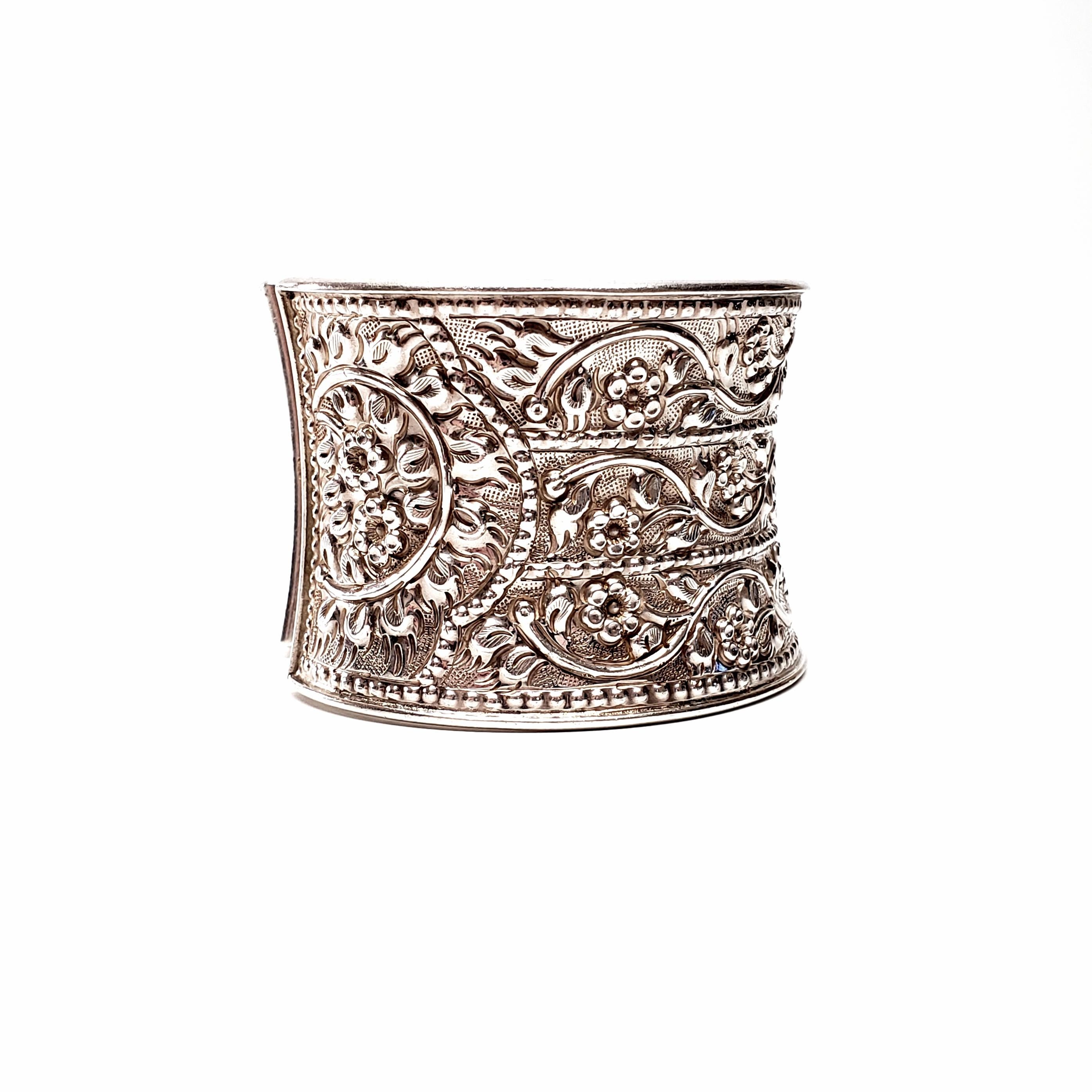 Sterling silver wide floral cuff bracelet designer Samuel Benham (BJC).

Beautiful repousse floral design with beaded and etched accents.

Measures approx 6 1/4
