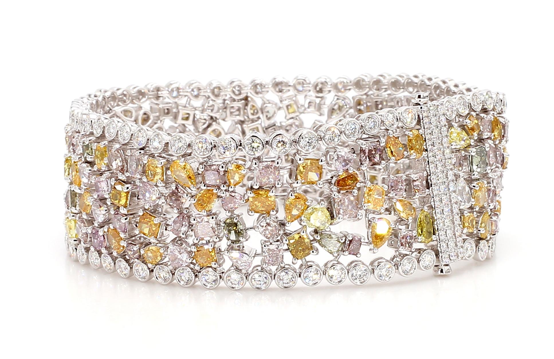 This Fancy Color Diamond Bracelet showcases a harmonious blend of mixed shape and colored diamonds. A testament to fine craftsmanship. Very Flexible and well-made. One-of-a-Kind masterpiece.

The bracelet features an array of stunning hues,