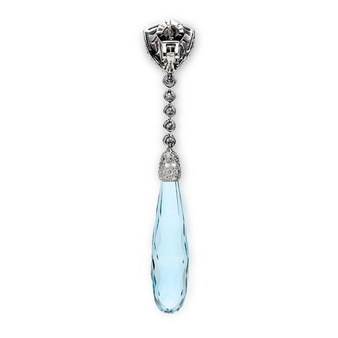 A Pair of "Samuel Getz" 18 Karat White Gold Drop Pendant Earrings Featuring a Pair of Long Briolette Aquamarines weighing 68.88 Carats, [34.56 ct., 43.73 x 11.43 x 11.29 mm., 34.32 ct., 45.16 x 11.16 x 10.90 mm.], a Pair of Very Fine