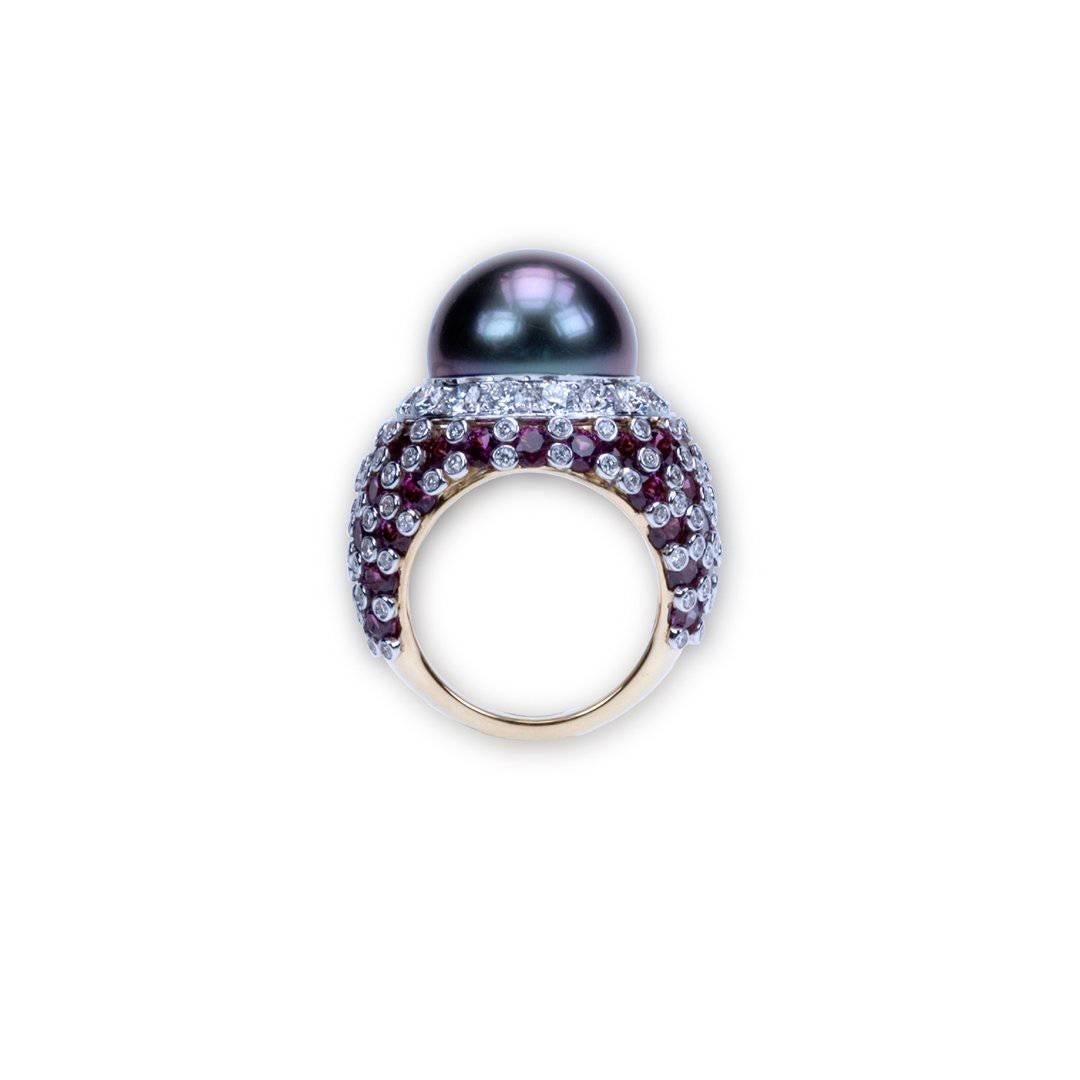 A “Samuel Getz” 18 Karat White and Yellow Gold Ring Featuring a Very Fine Round Aubergine Tahitian Pearl, 14.5 MM., 57 Round Brilliant Cut Purple Garnets, 8.77 Carats, and 132 Round Brilliant Cut Diamonds, 2.70 Carats of F Color and VVS1 – VS2