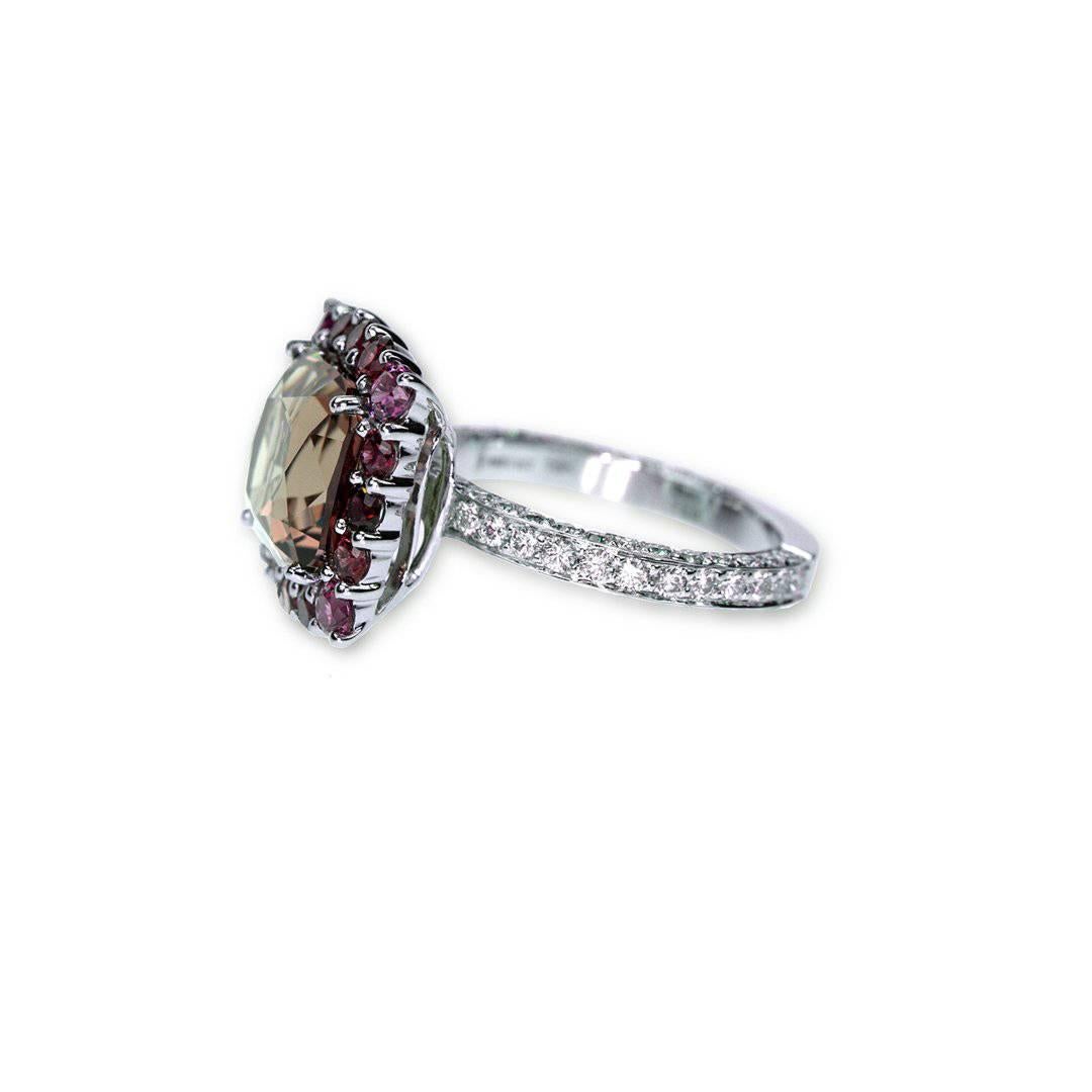 A "Samuel Getz" 18 Karat White Gold Ring  Featuring a Rare and Unusual Square Brilliant Step Cut Natural Color-Changing [From Olive Green in Daylight to Orangey-Red in Incandescent Light] Garnet, 6.85 Carat [10.26 x 10.25 x 7.71 mm.] [GRS