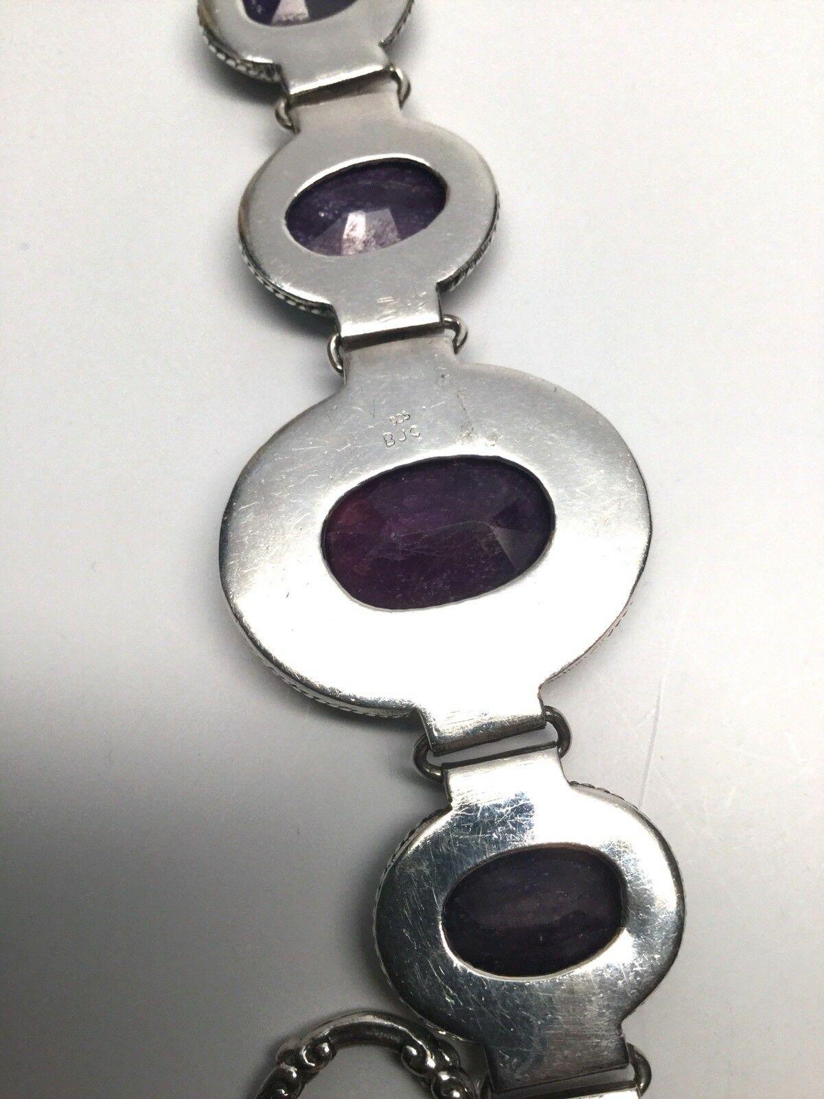 Samuel J Benham BJC Sterling Silver Purple Amethyst Toggle Bracelet

Measurement:  Approx 8 3/4 inches long.  The largest stone measures approx. 18 mm length x 13 mm width.

Weight:  25.7 dwt / 40 g

Condition:  In good condition with some minor