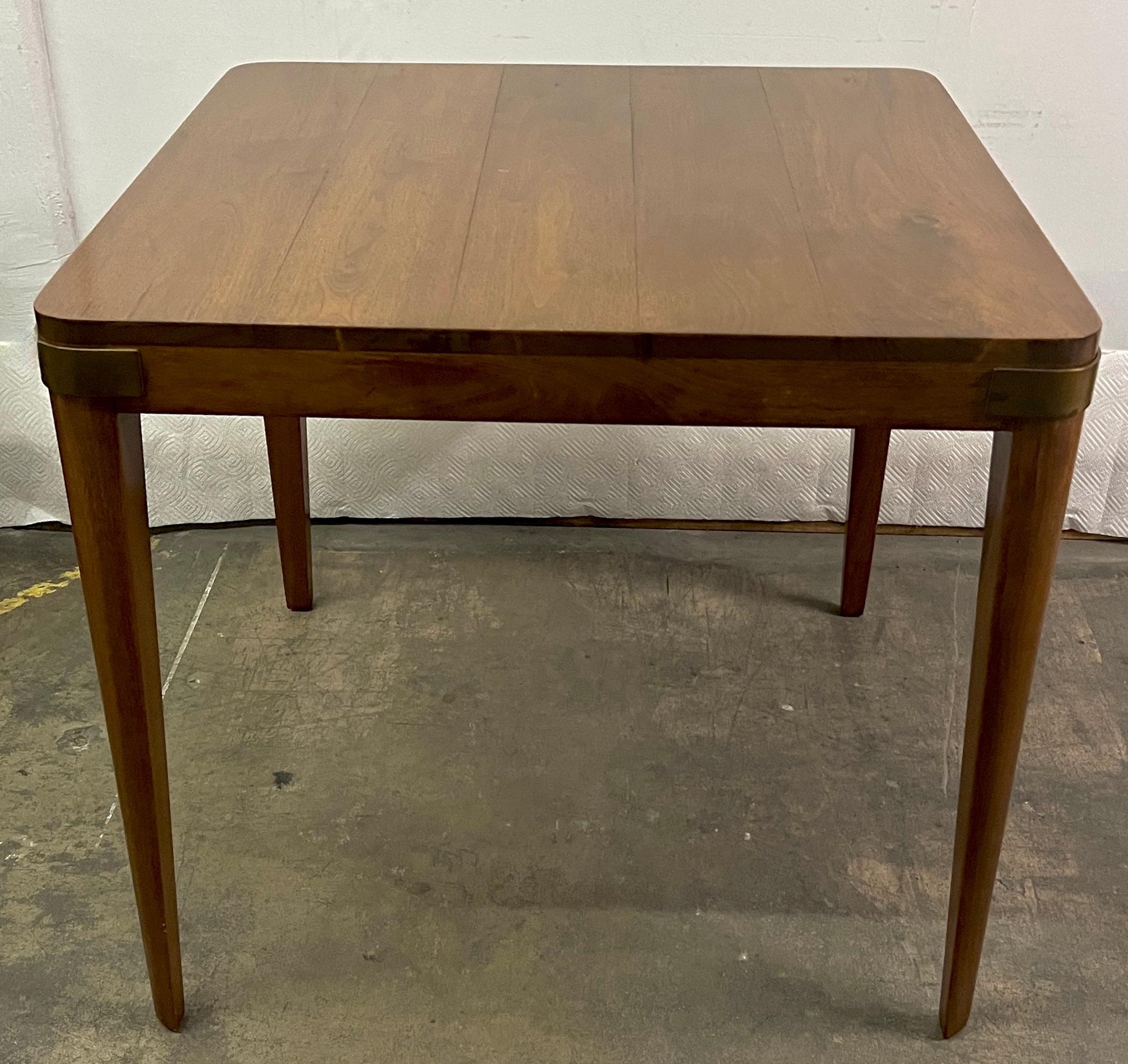 A wonderful game, card or dessert table.  The legs are very sexy as they taper down and on each corner is a large banding of brass.

The piece would be nice table for use in any room, however, especially very nice in the Den, Library, or as a table