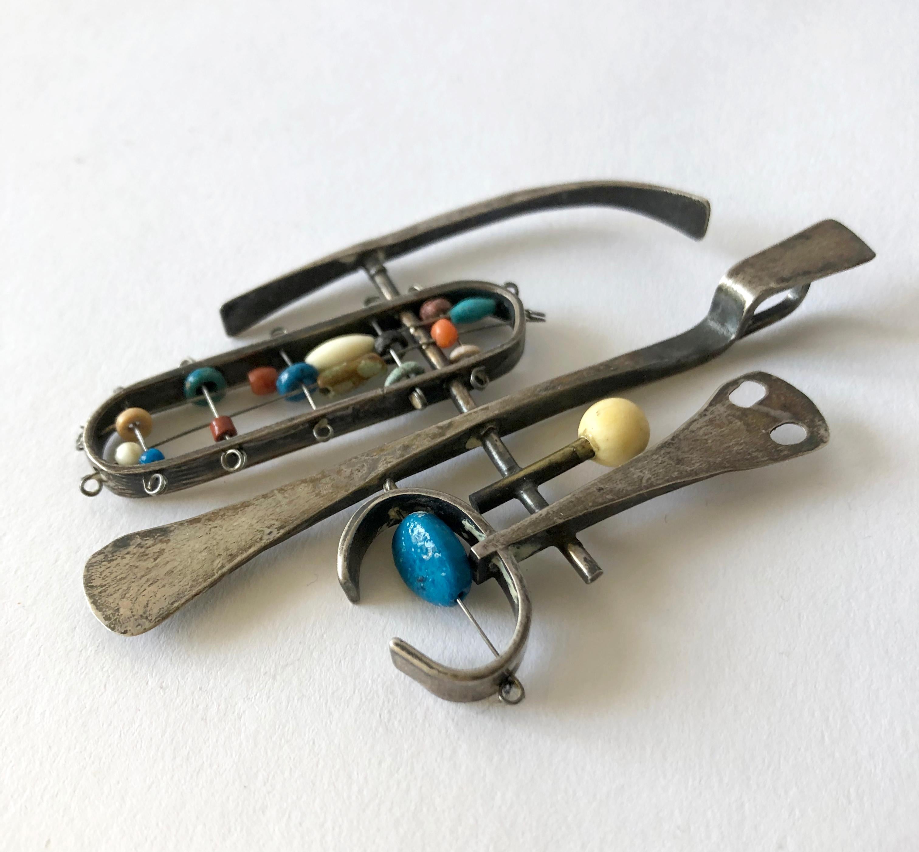 Rare, hand wrought modernist pendant of sterling silver, brass, steel wire and Native American trade beads created by Sammy Gee of San Francisco, California.  Pendant measures  3.5