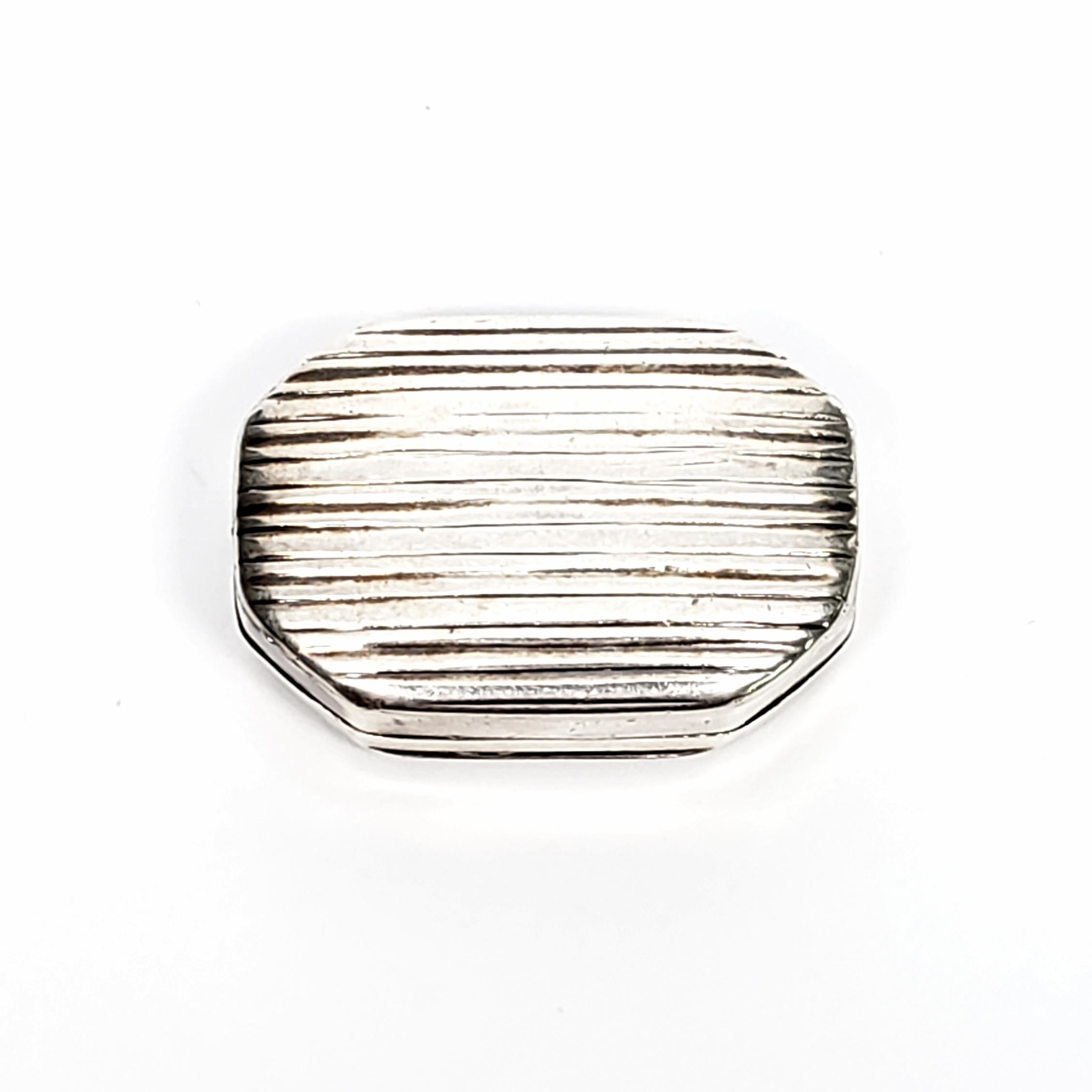 Antique sterling silver vinaigrette box by Samuel Pemberton, circa 1802.

This is a beautiful example of the small decorative boxes that were used to carry perfume and scents when traveling. The scent would be soaked into a sponge that would be