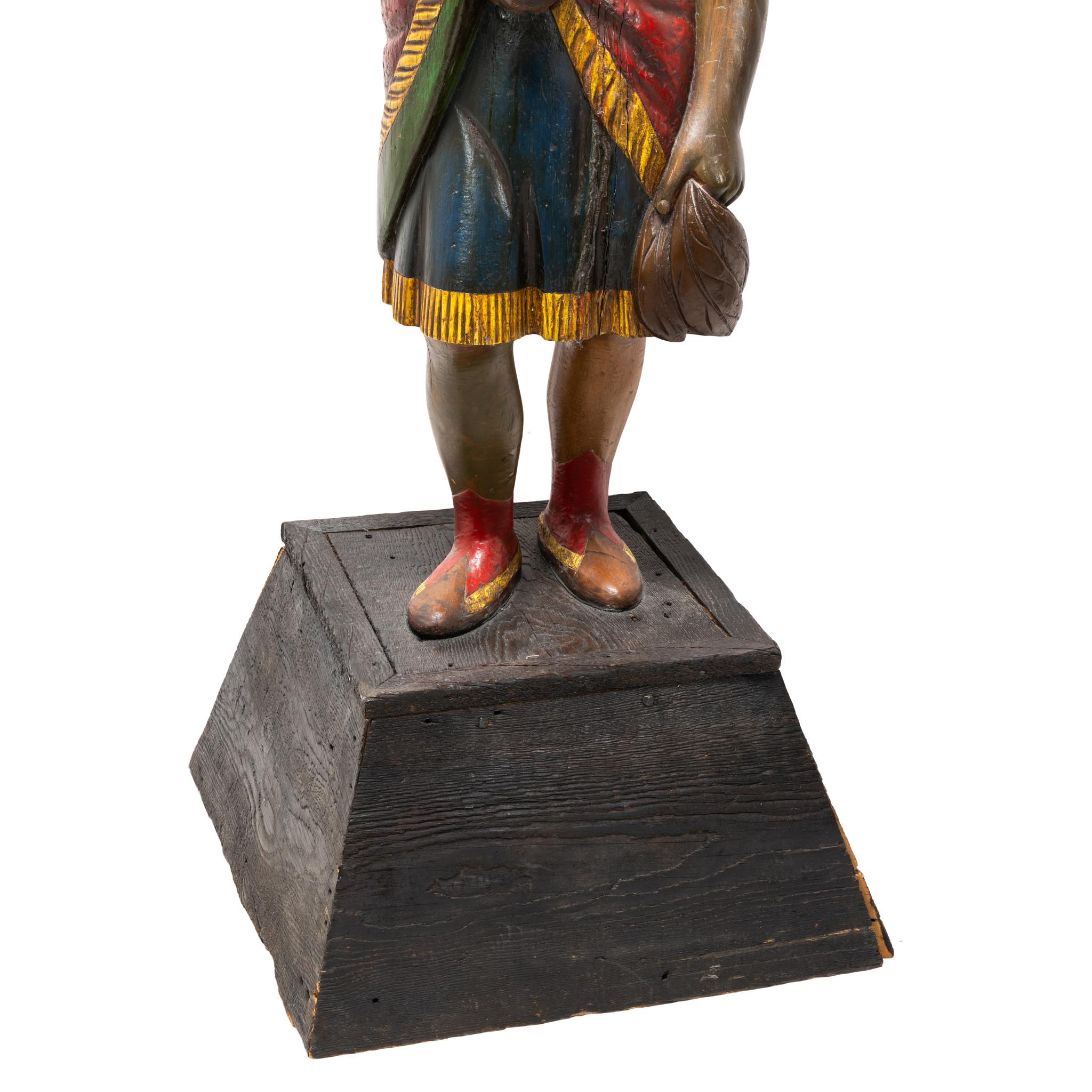 Samuel Robb tobacco trade sign Indian princess (1851-1928). Carved and polychrome painted wood. Colors are bright in tones of red, blue, and yellow. With feathered headdress. Late 19th Century. 58