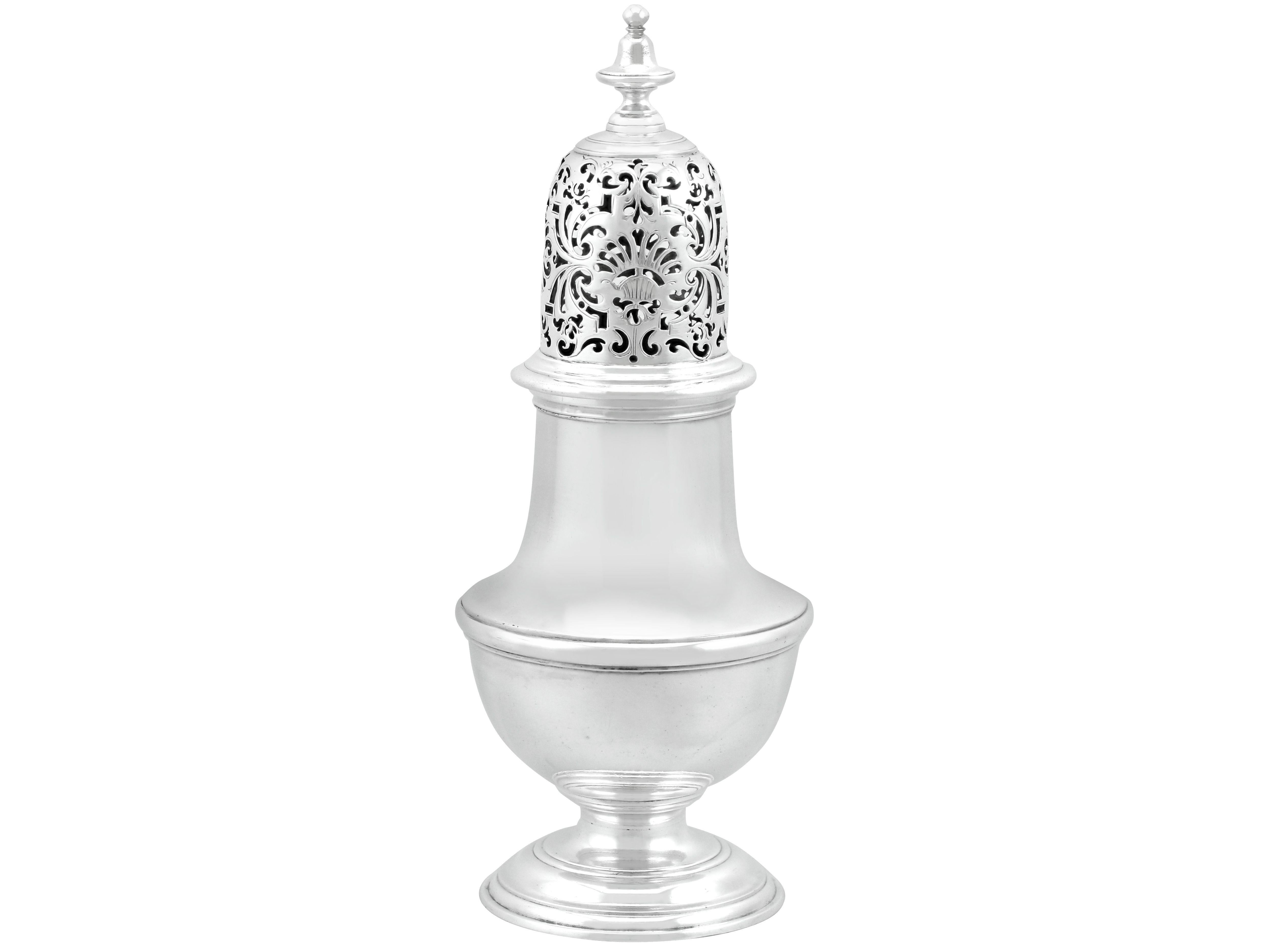 An exceptional, fine and impressive antique Georgian English sterling silver sugar caster by Samuel Wood; an addition to our silver teaware collection

This exceptional and large antique Georgian sterling silver sugar caster has a circular