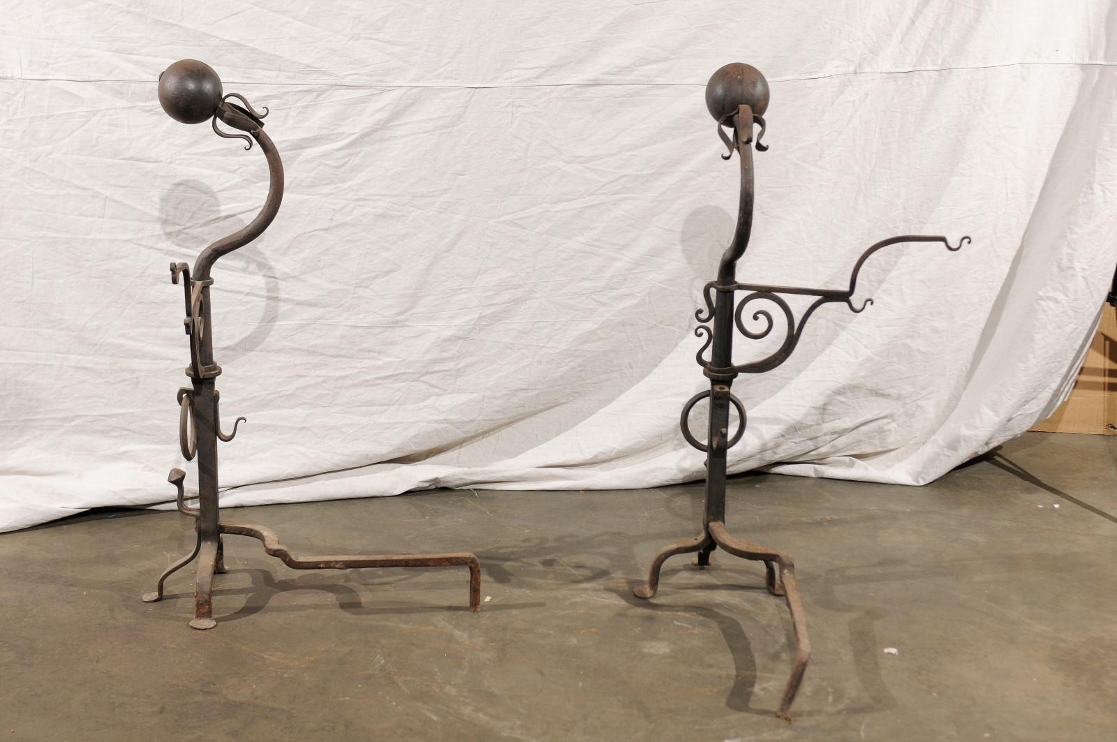 Samuel Yellin Style Pair of 20th Century Jumbo Iron Andirons with Cooking Arms In Good Condition For Sale In Atlanta, GA