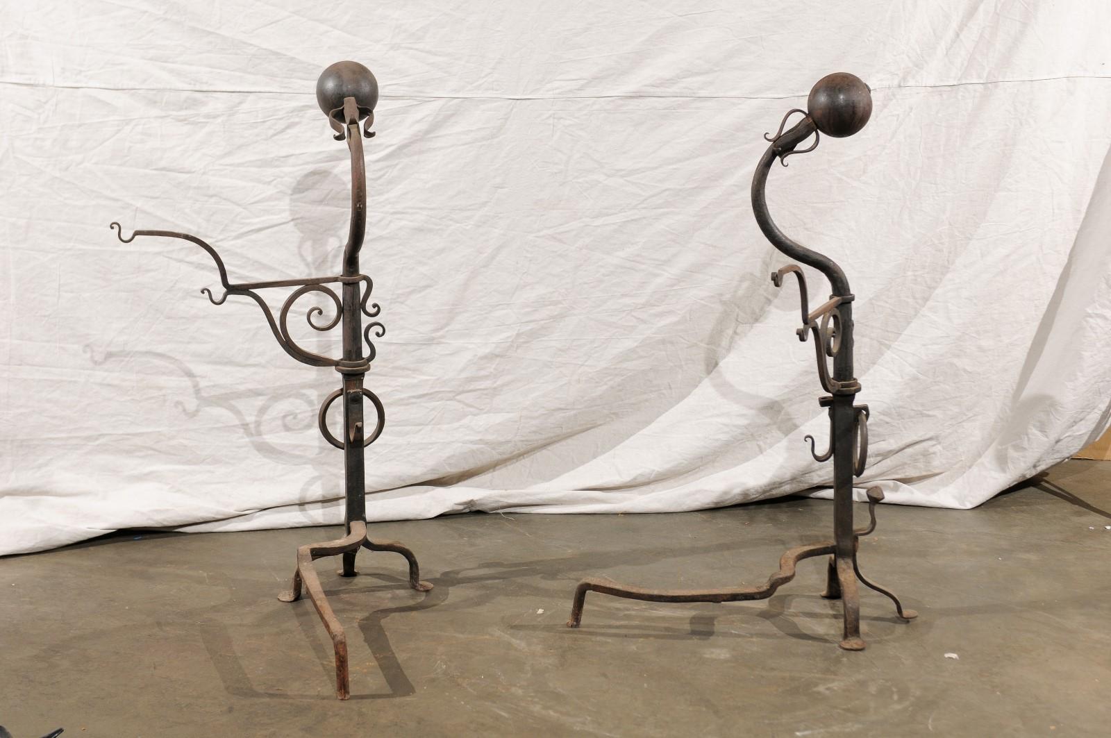 Samuel Yellin Style Pair of 20th Century Jumbo Iron Andirons with Cooking Arms For Sale 1