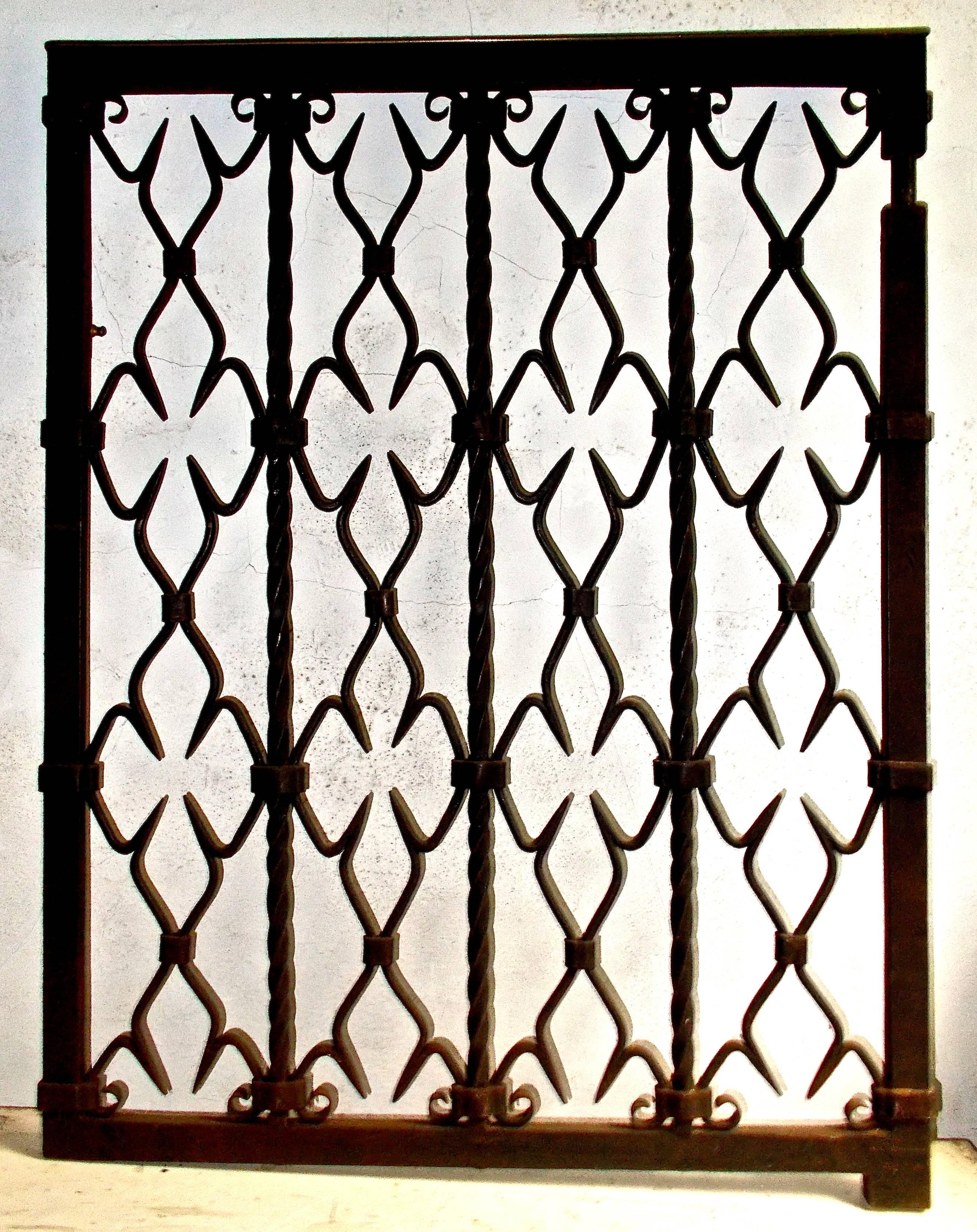 Classic Yellin small gate. Hand-forged wrought iron with a brass rail across the top.  Weight: about 80lbs.