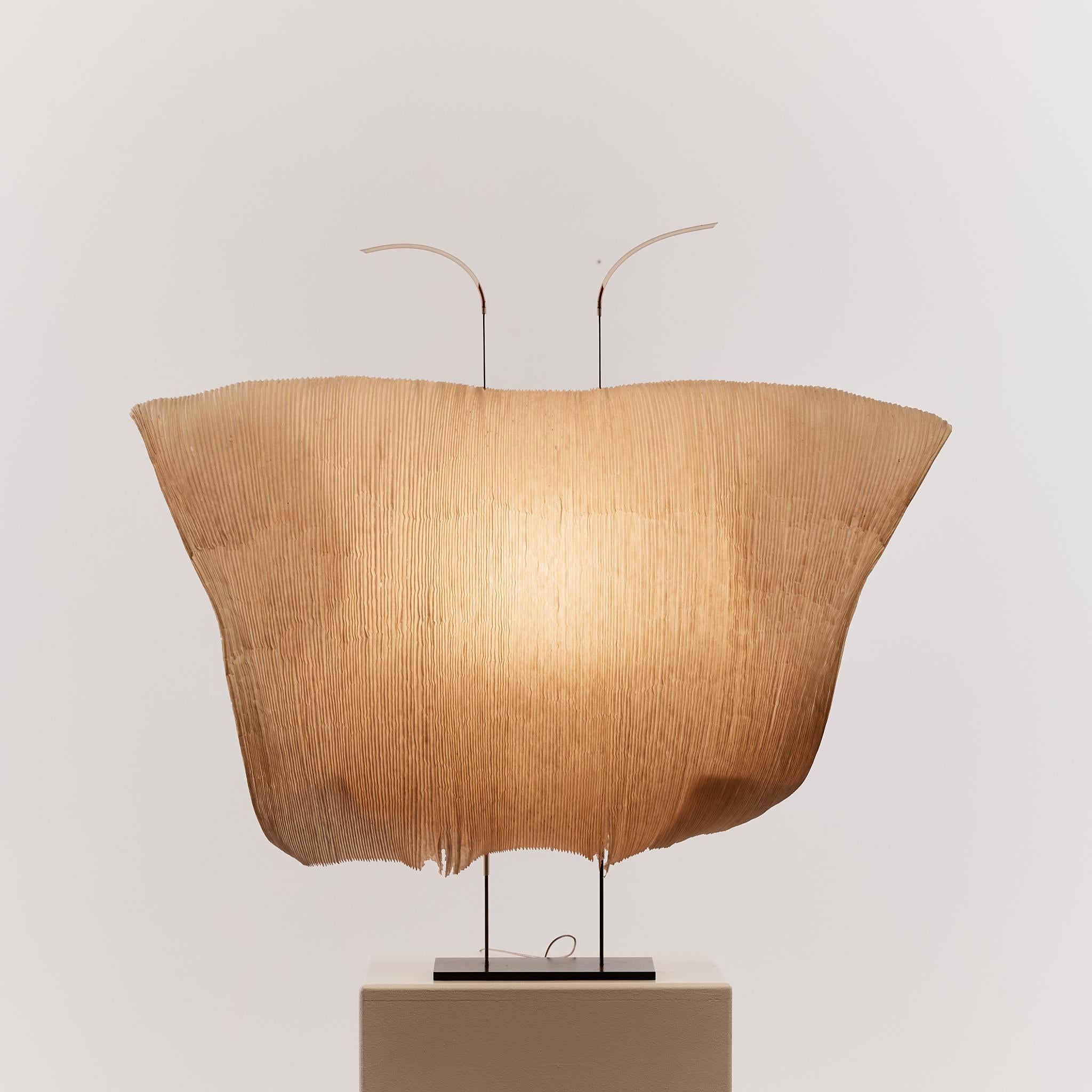 The delicate sculptural 'Samurai' table lamp by Ingo Maurer and Dagmar Mombach was part of the original 'MaMo Nouchies' series, no longer in production.

Inspired by the forms of Isamu Noguchi and the practice of Akari paper craft, the pair