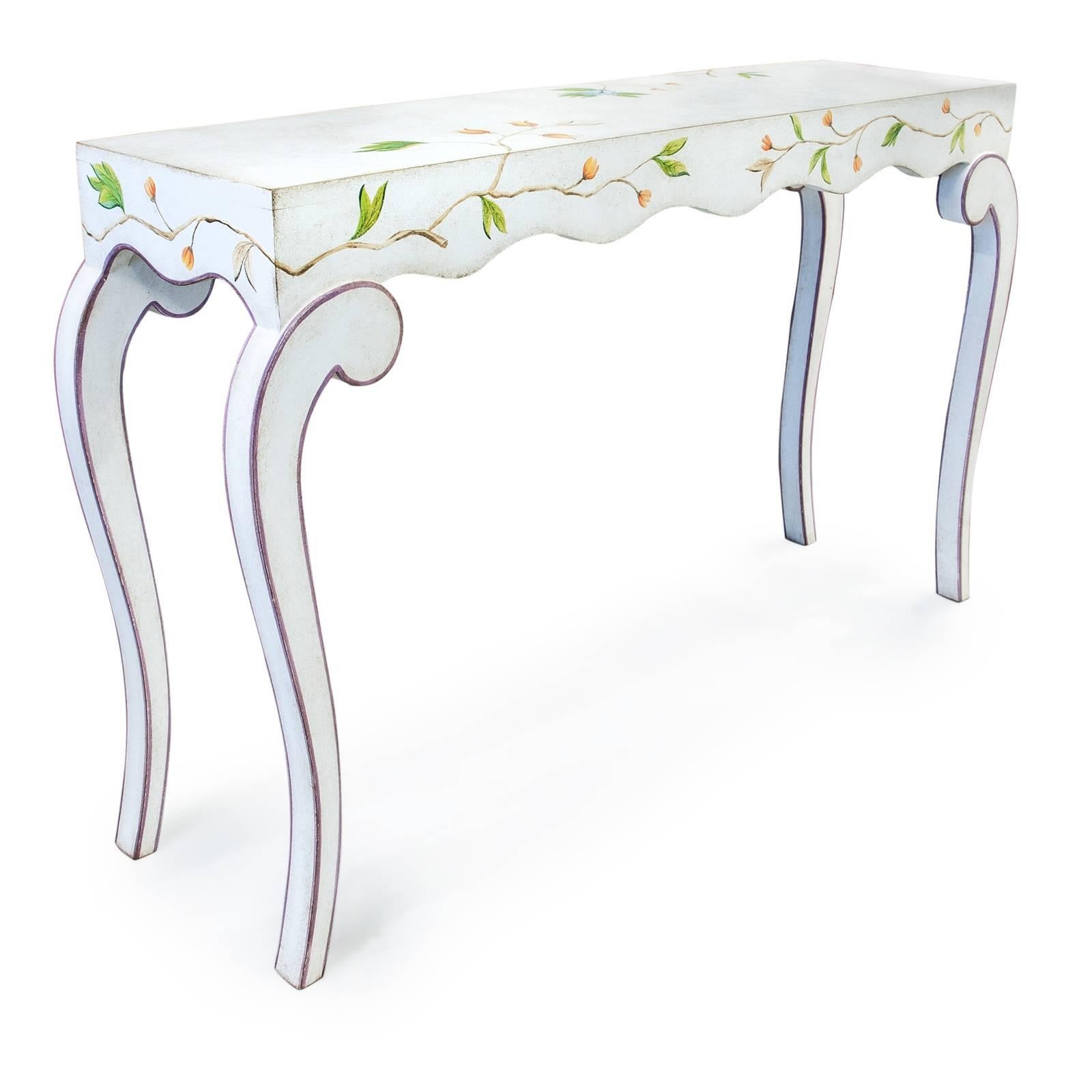 Standing tall on four graceful saber legs, behind the simple design of this Venetian-inspired console lies impeccable craftsmanship and attention to detail that will make it a statement piece in any decor. The rectangular top has an undulated border