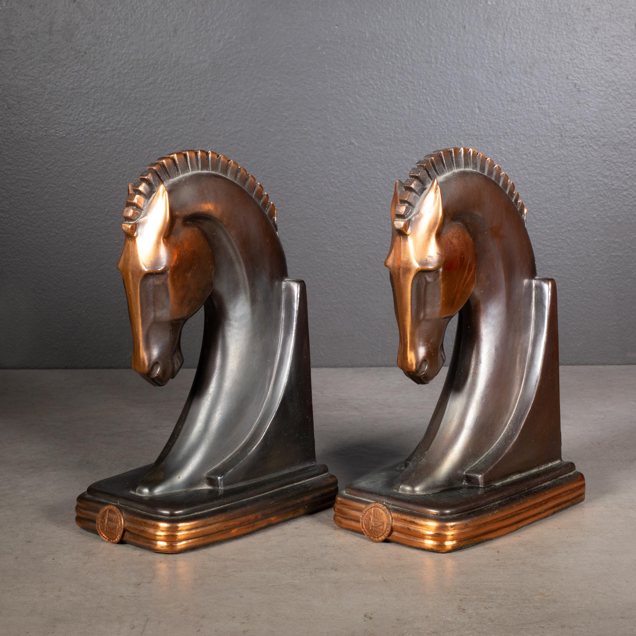 ABOUT

An original pair of bronze and copper plate Art Deco Trojan horse bookends. Both bookends have bronze plaques attached 