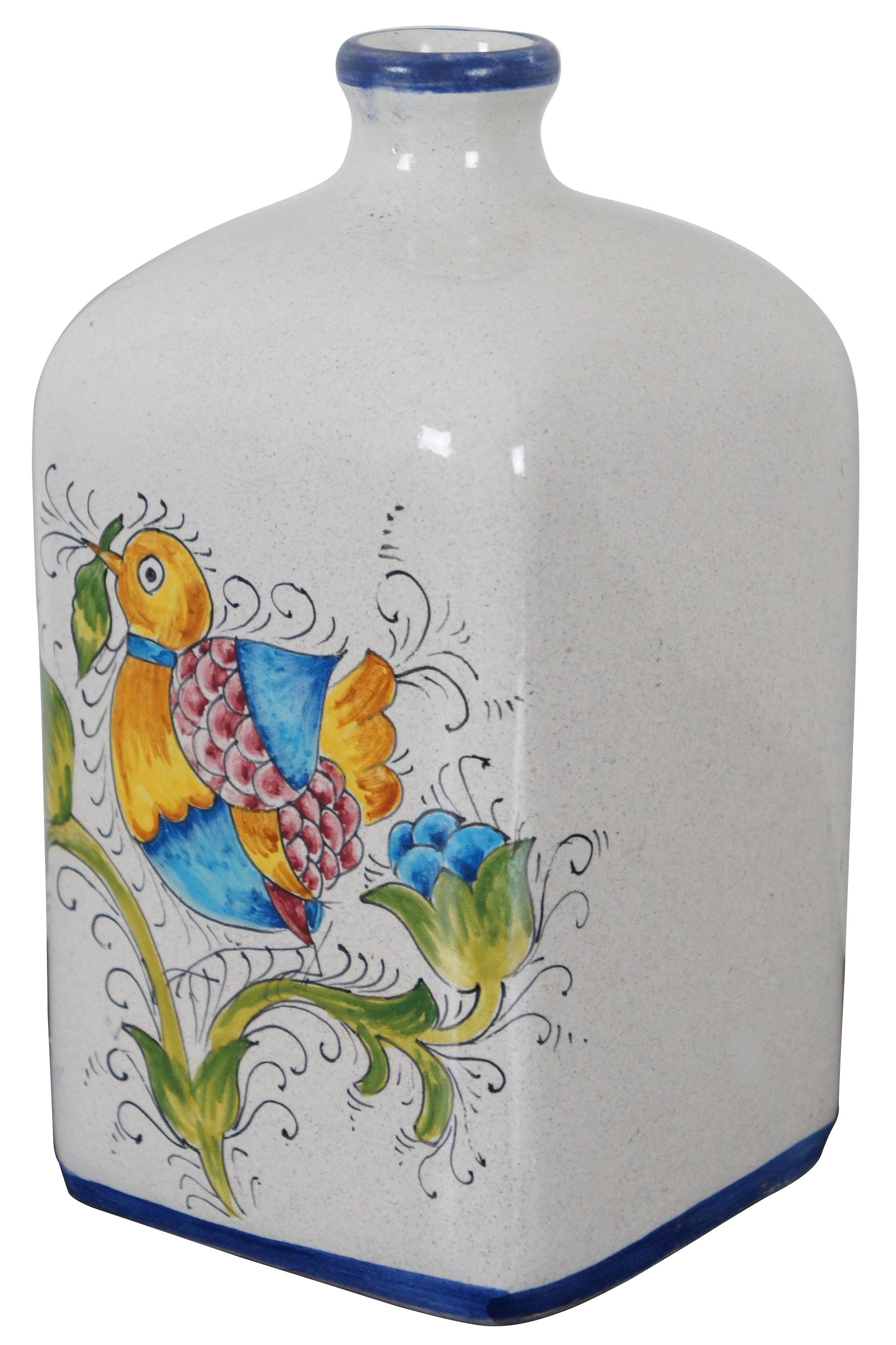 Vintage hand painted ceramic bottle made in San Gimignano, Italy, painted with flowers and a bird in the shape of a vase, pharmacy bottle or jug. Measures: 8”.
  