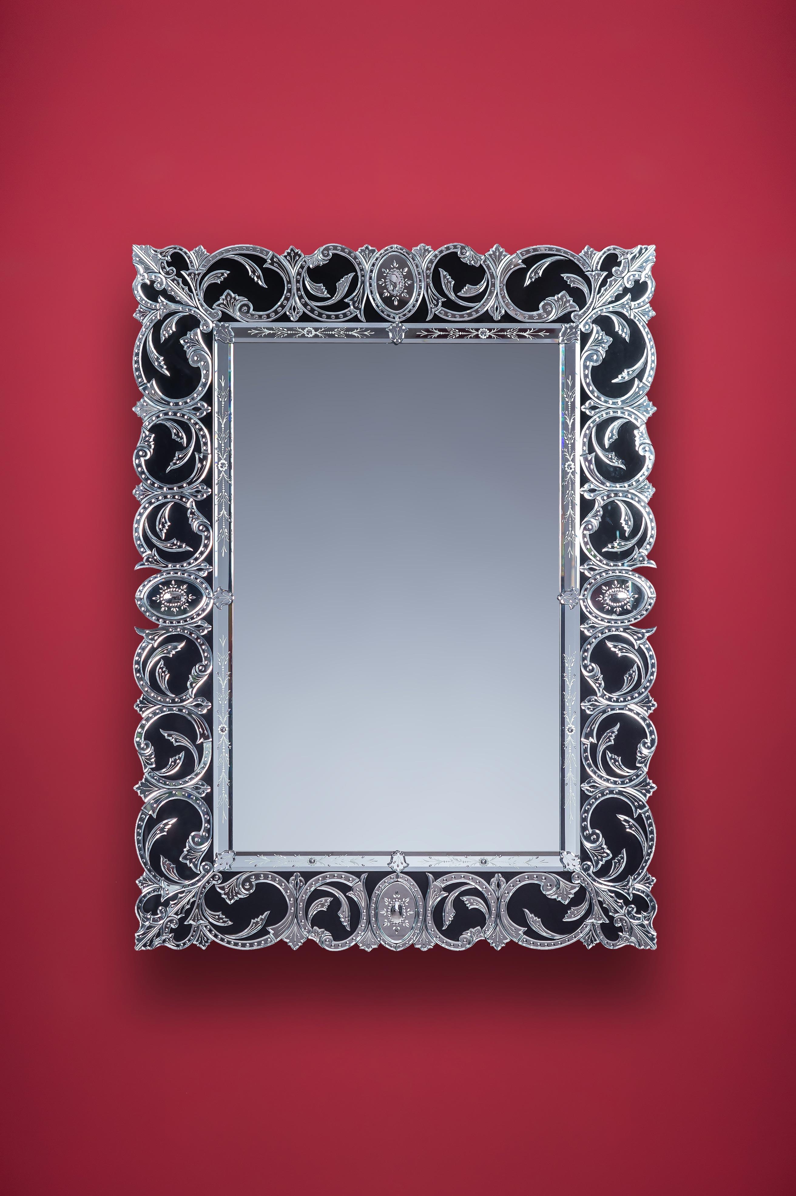 Luxurious mirror in Murano glass, 19th century French style, made by Fratelli Tosi on a design by Fratelli Barbini Glass Mirror in the island of Murano, all beveled, engraved, carved and polished entirely by hand, the silvering in pure silver is
