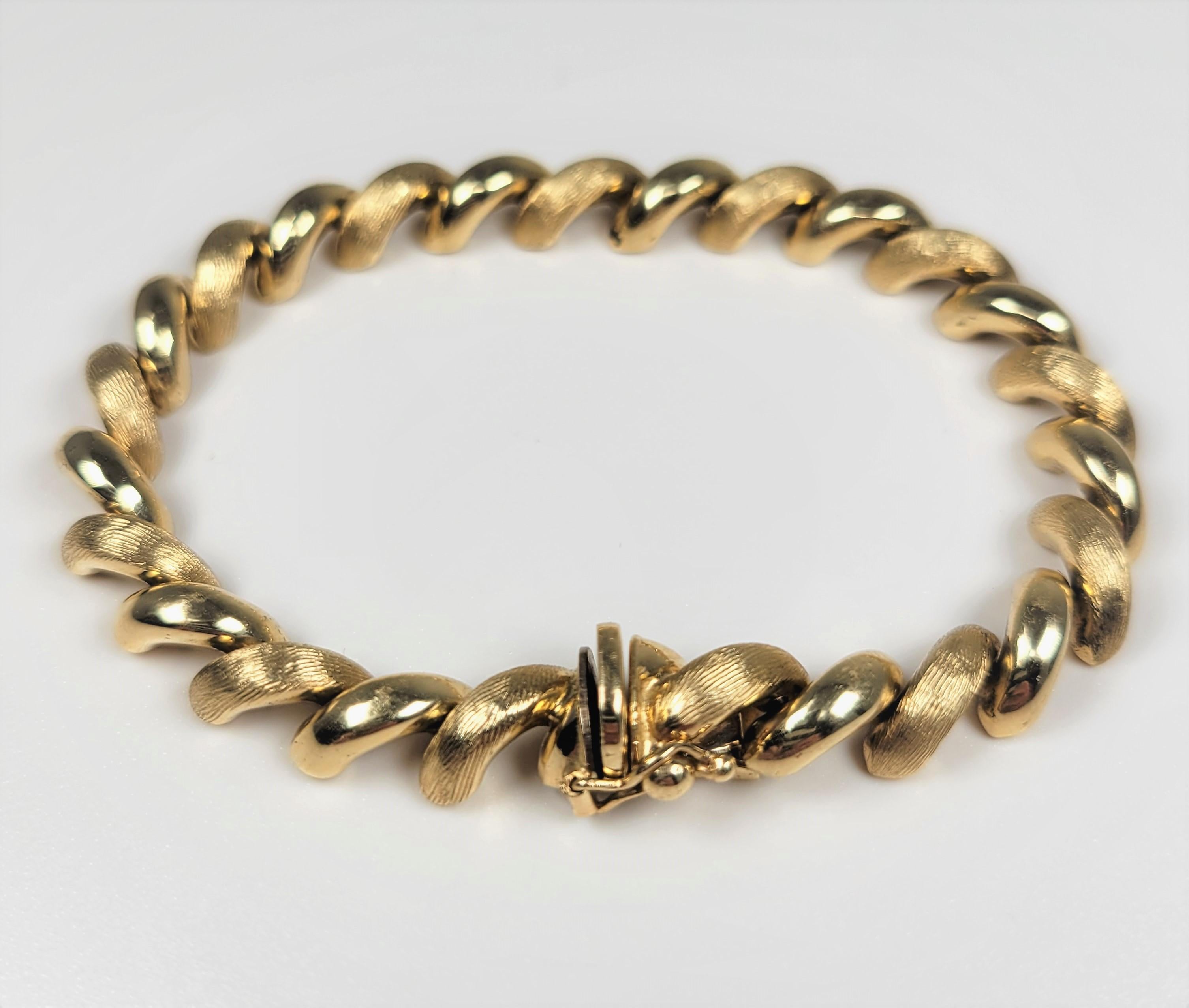 14 Karat yellow gold San Marco bracelet, with alternating polished and brushed links.  This bracelet is 7 inches long.