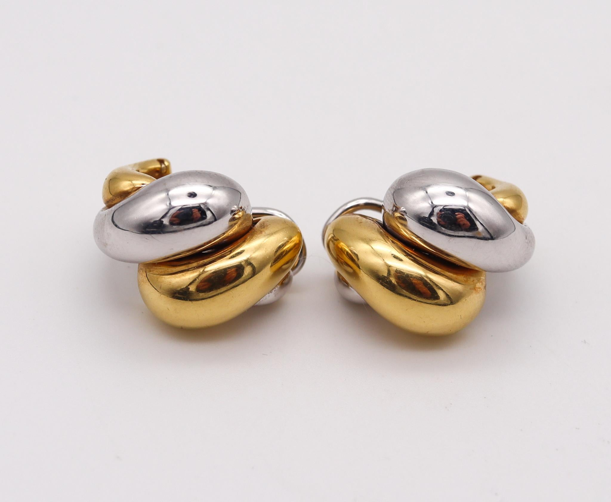 Bicolor clips on earrings made in Italy.

Beautiful and elegant pair of clips-on earrings, created in Vicenza Italy. These substantial bold earrings has been crafted with San Marcos patterns in solid yellow and white gold of 18 karats. Fitted with