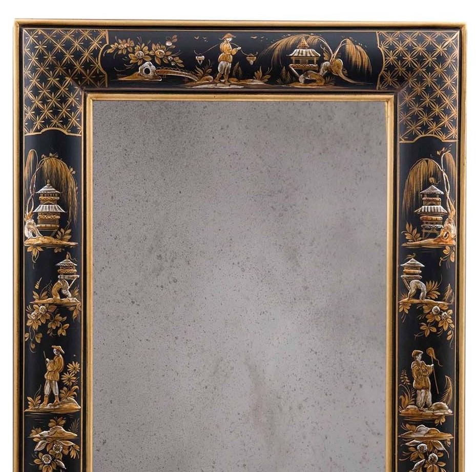 This stunning mirror is a superb example of masterful craftsmanship. Its rectangular wooden frame was decorated by hand with a background in San Polo black, and a delicate scene repeated in four different versions on the perimeter of the piece in