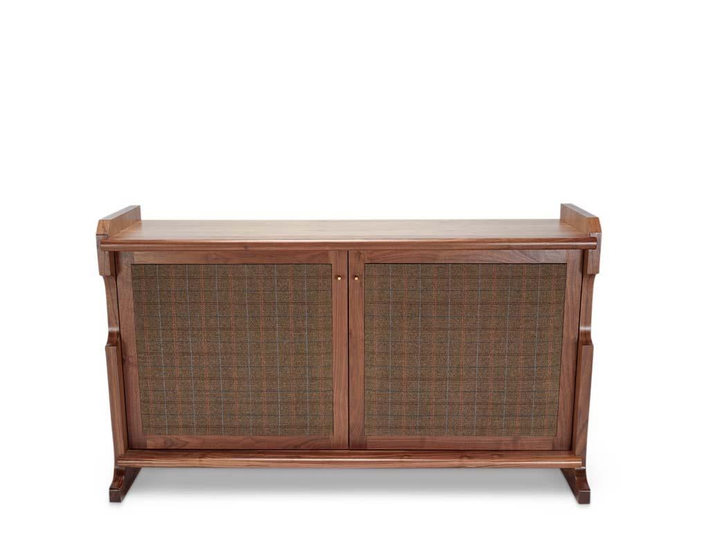 The San Rafael cabinet features a sturdy construction with upholstered doors and elegant contours. Cabinets can be custom-made in a two-door version with open storage or a one-door version with a bank of drawers.

The Lawson-Fenning Collection is