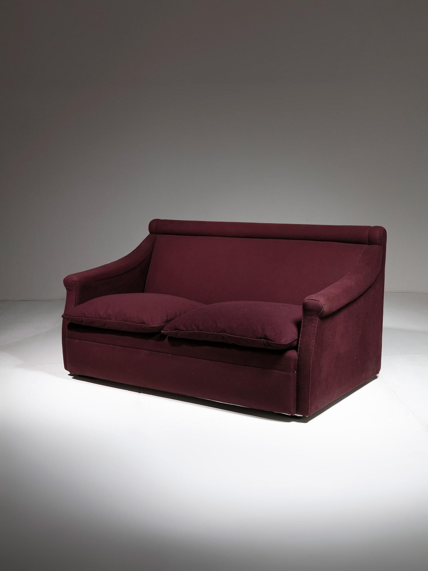 San Siro settee model P16 by Luigi Caccia Dominioni for Azucena.
Original plum felt cover; extremely comfortable seating featuring feather cushions with removable covers.