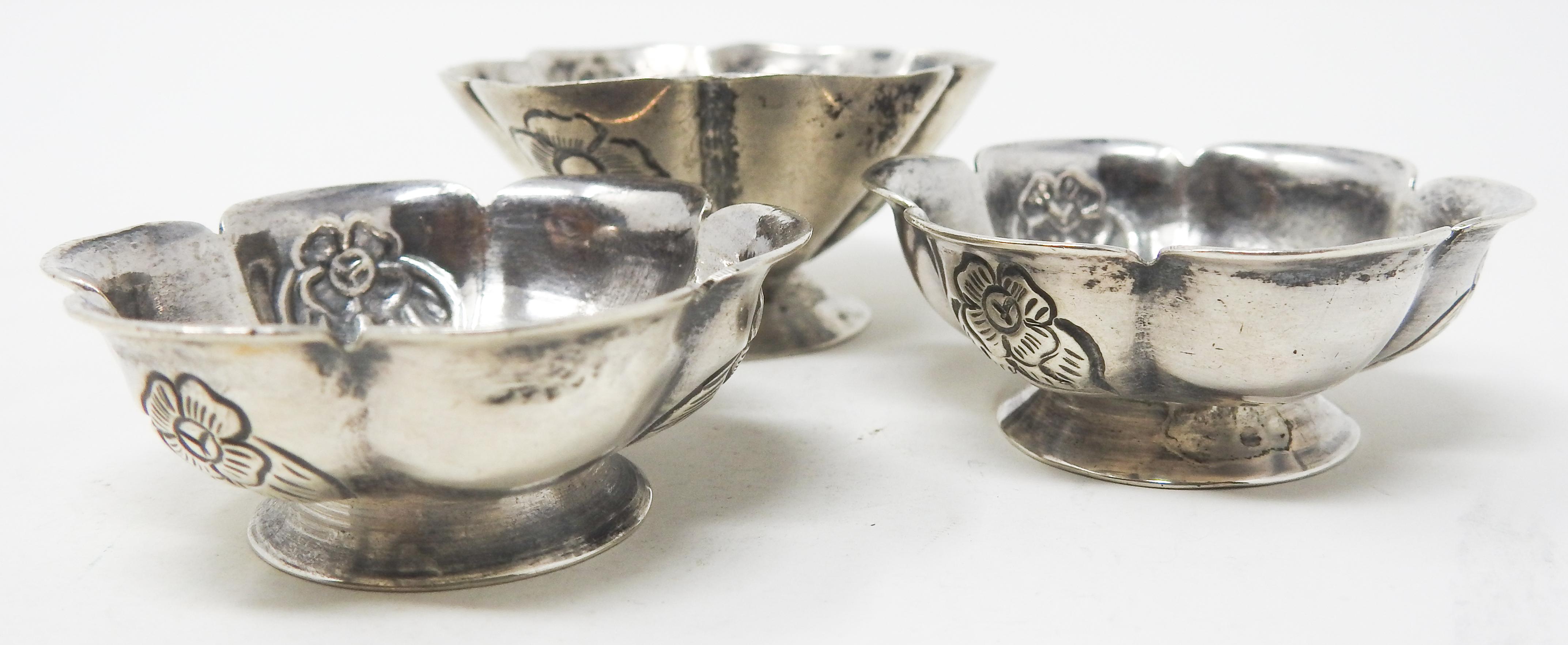 Offering this set of gorgeous Sanborns sterling silver salt wells. These are simple scalloped edge with floral and foliate detail engraved in every other scallop. The bottom of two are marked Sanborns, Mexico, and the other is just marked 900.