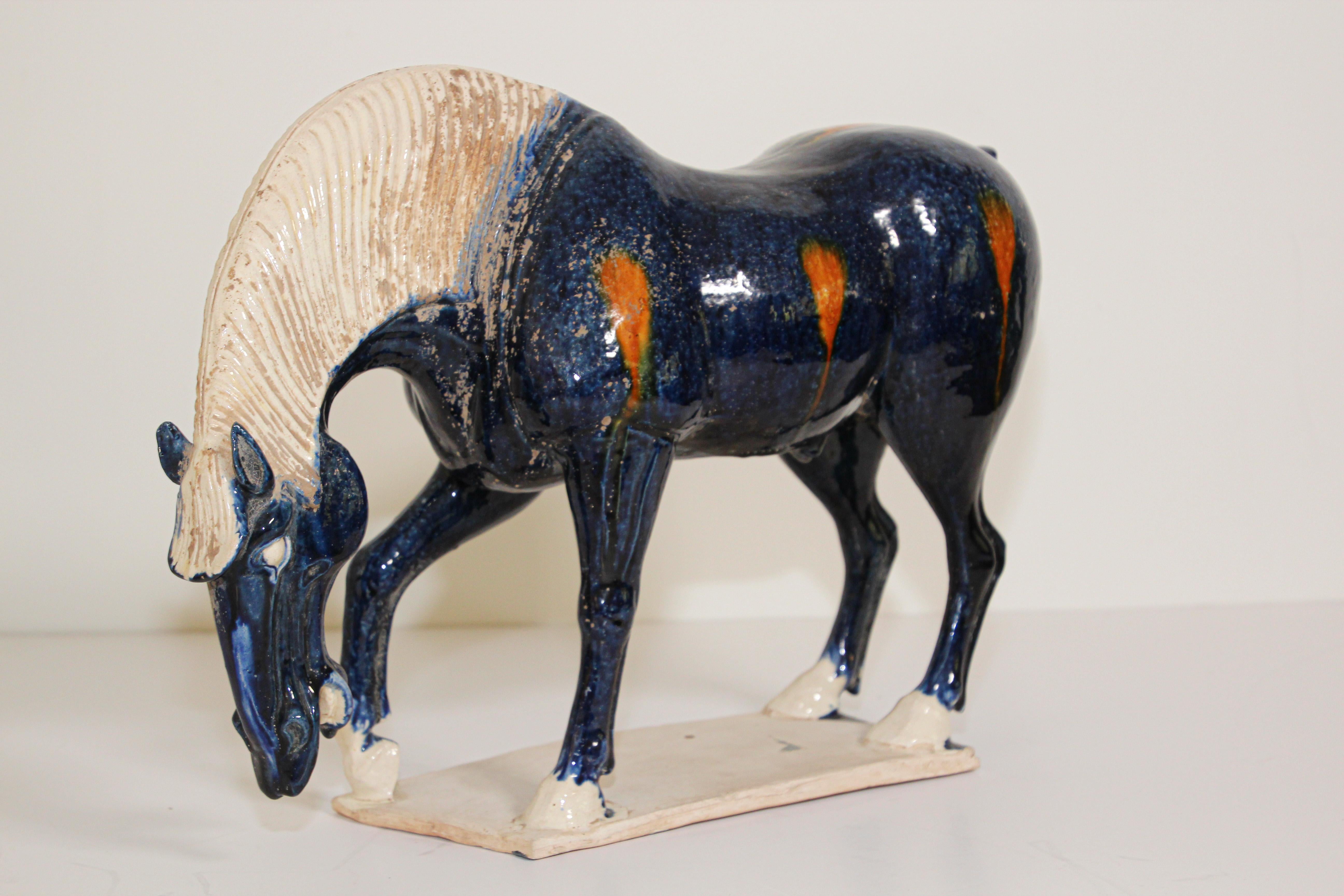 Vintage Sancai glazed blue pottery horse statue Chinese Tang Dynasty manner.
Made from traditional glazed ceramic in glossy blue and orange.
The Tang Dynasty was one of the most brilliant periods in China's long history - was characterized by a