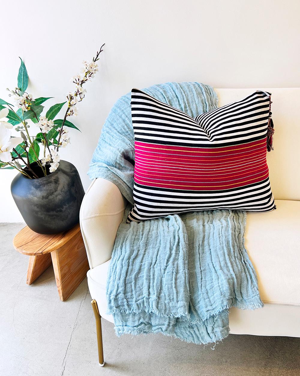 This SanCri Pillow features bold black, white and viva magenta stripes for a distinct Mexican design. Handmade in Latin America, it is the perfect addition to any local home decor or interior design setting. Fair trade certified for social