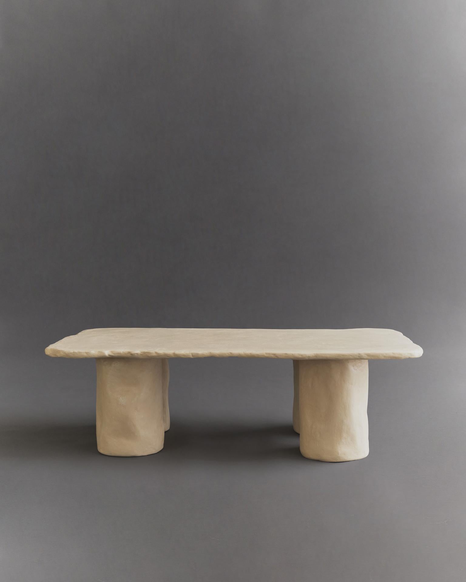 Ōmbia Studio is a ceramic sculpture and design studio based in Los Angeles. The name and its roots originates from Colombia, where designer and founder Cristina Moreno comes from.

Inspired by stone slabs, this table embodies texture, organic