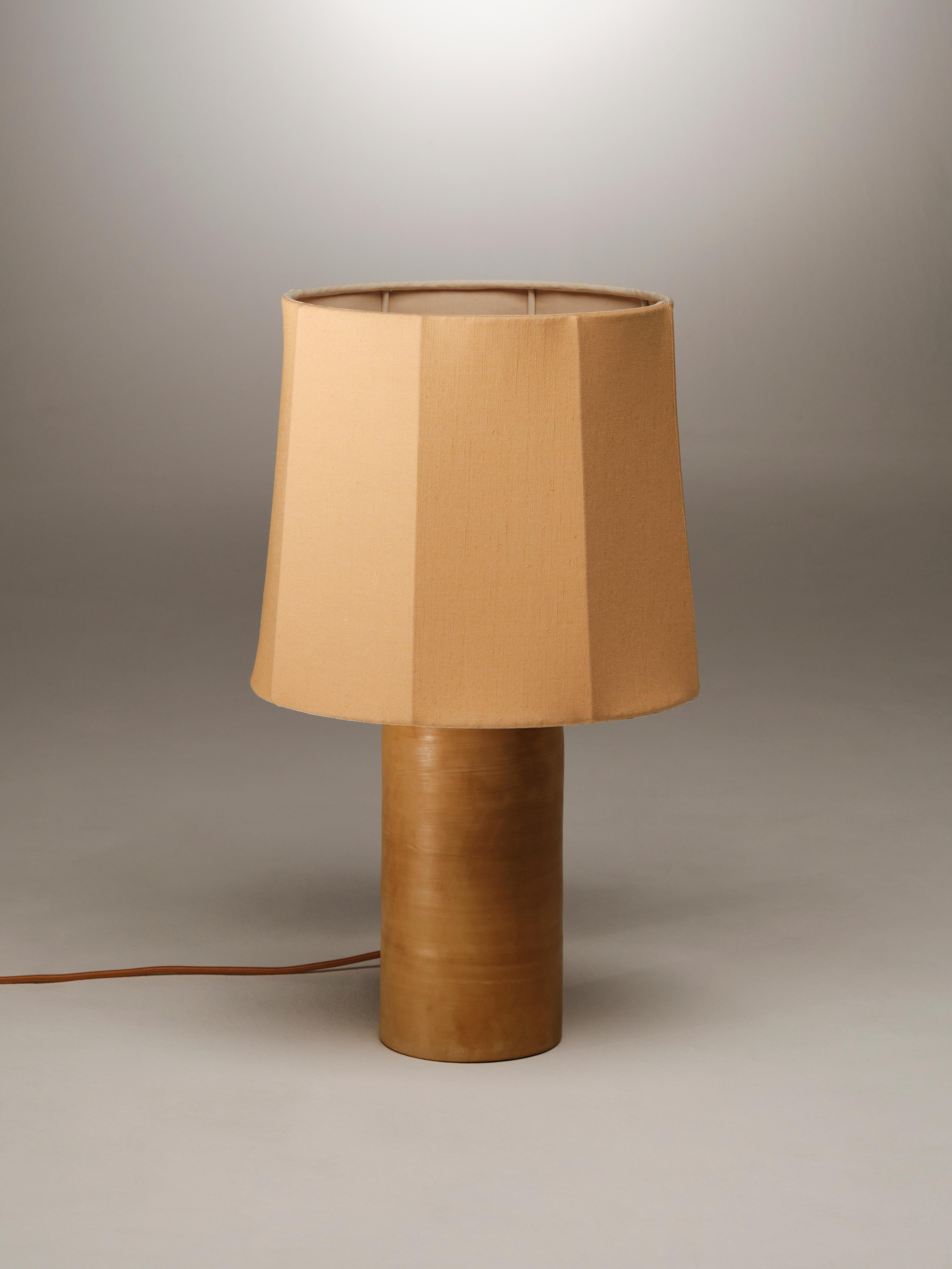 Sand Medium Sonora Linen Table Lamp by NASSI
Dimensions: W 35 x D 35 x H 58 cm. 
Materials: Lampshade: coated iron, warm white Cotton Lining.
Base: wood-fired clay with beeswax finish.

Also available in 4 colors (Warm White, sand, caramel and