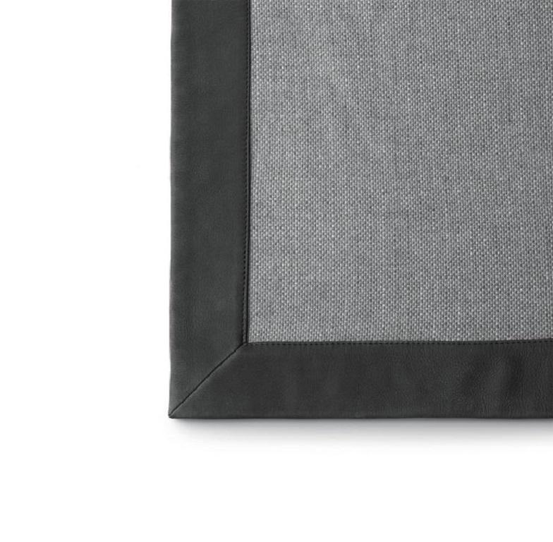 Wool and Nubuck Blanket by Marta Ferri. Expert-crafted in Italy exclusively by Molteni&C.

Marta Ferri's Italian-made monochromatic grey blanket is crafted from finely woven wool with a soft Nubuck leather border for an elevated throw on a sofa or