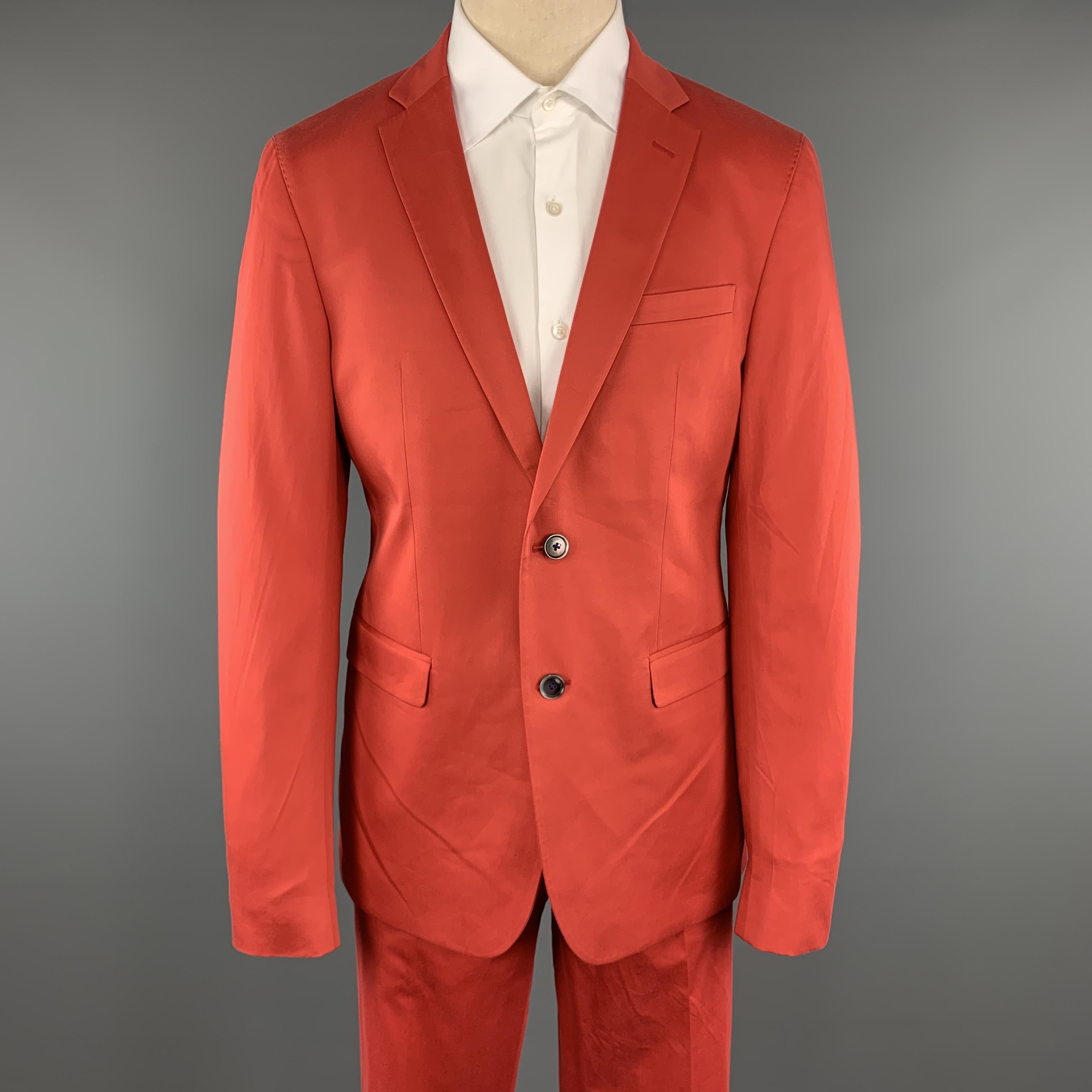 SAND Suit comes in a coral cotton blend and includes a single breasted, two button sport coat with a notch lapel lapel and matching front trousers. 

Excellent Pre-Owned Condition.
Marked: 54

Measurements:

-Jacket
Shoulder: 17.5 in. 
Chest: 44 in.